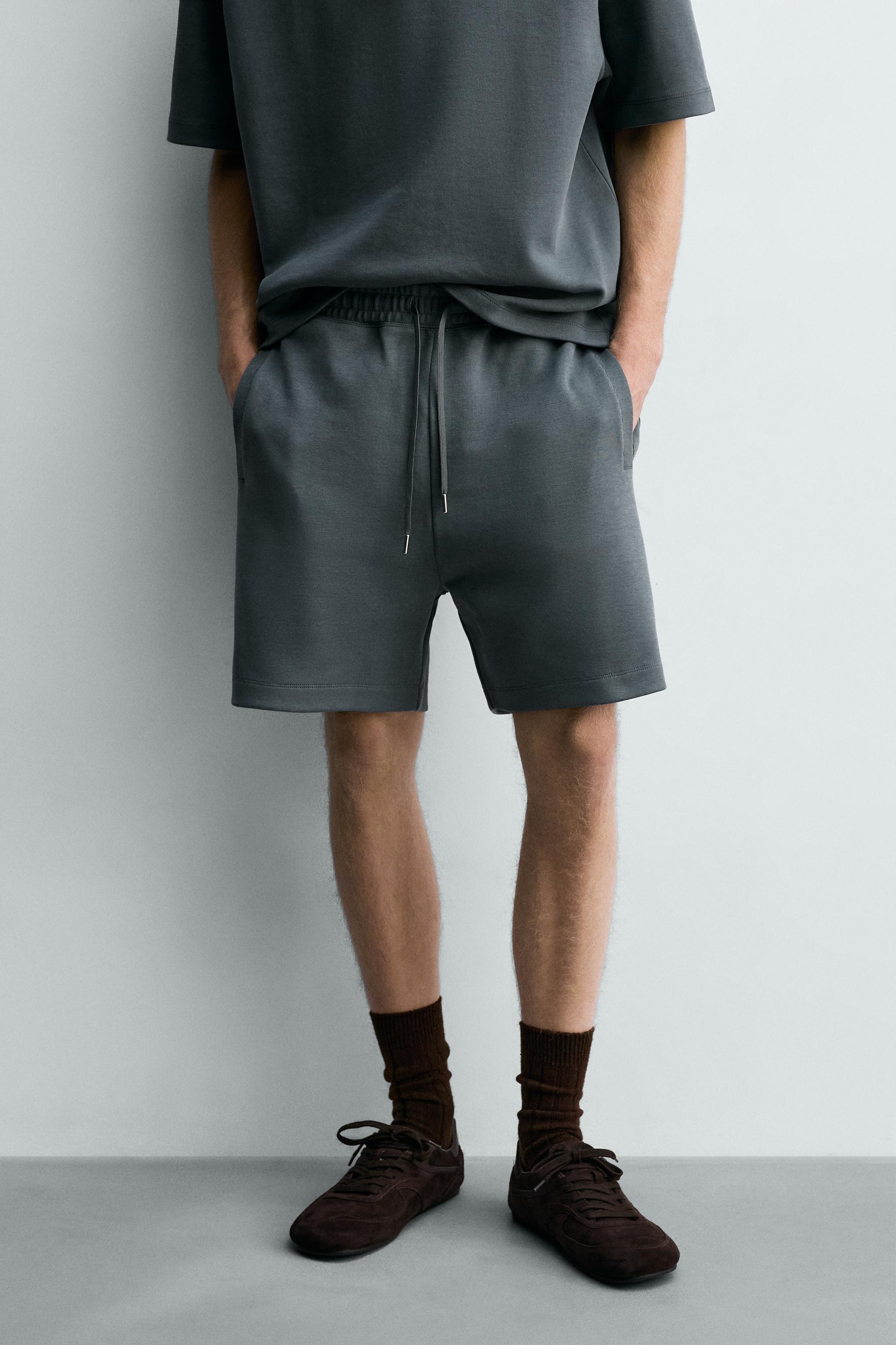RELAXED FIT INTERLOCK TRACK SHORTS — Faded blue