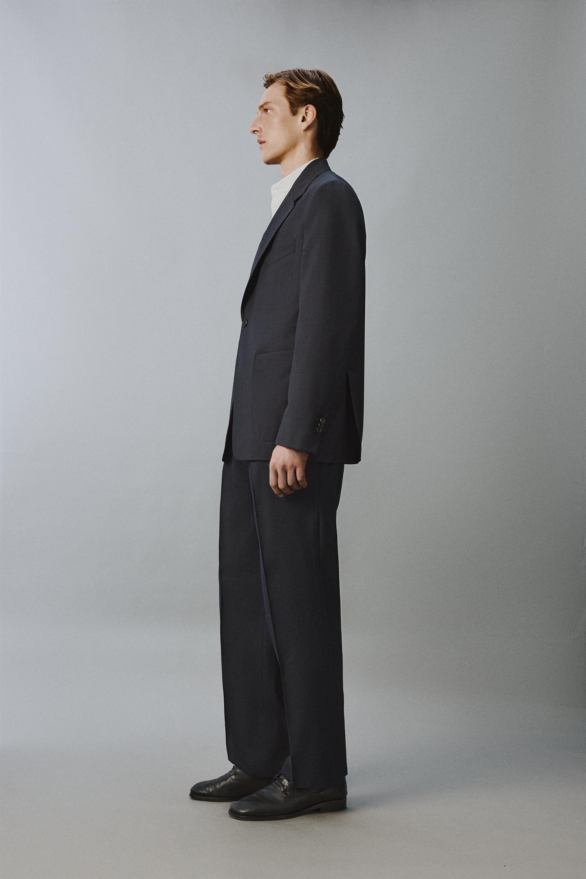 100% WOOL RELAXED FIT PLEATED PANTS
