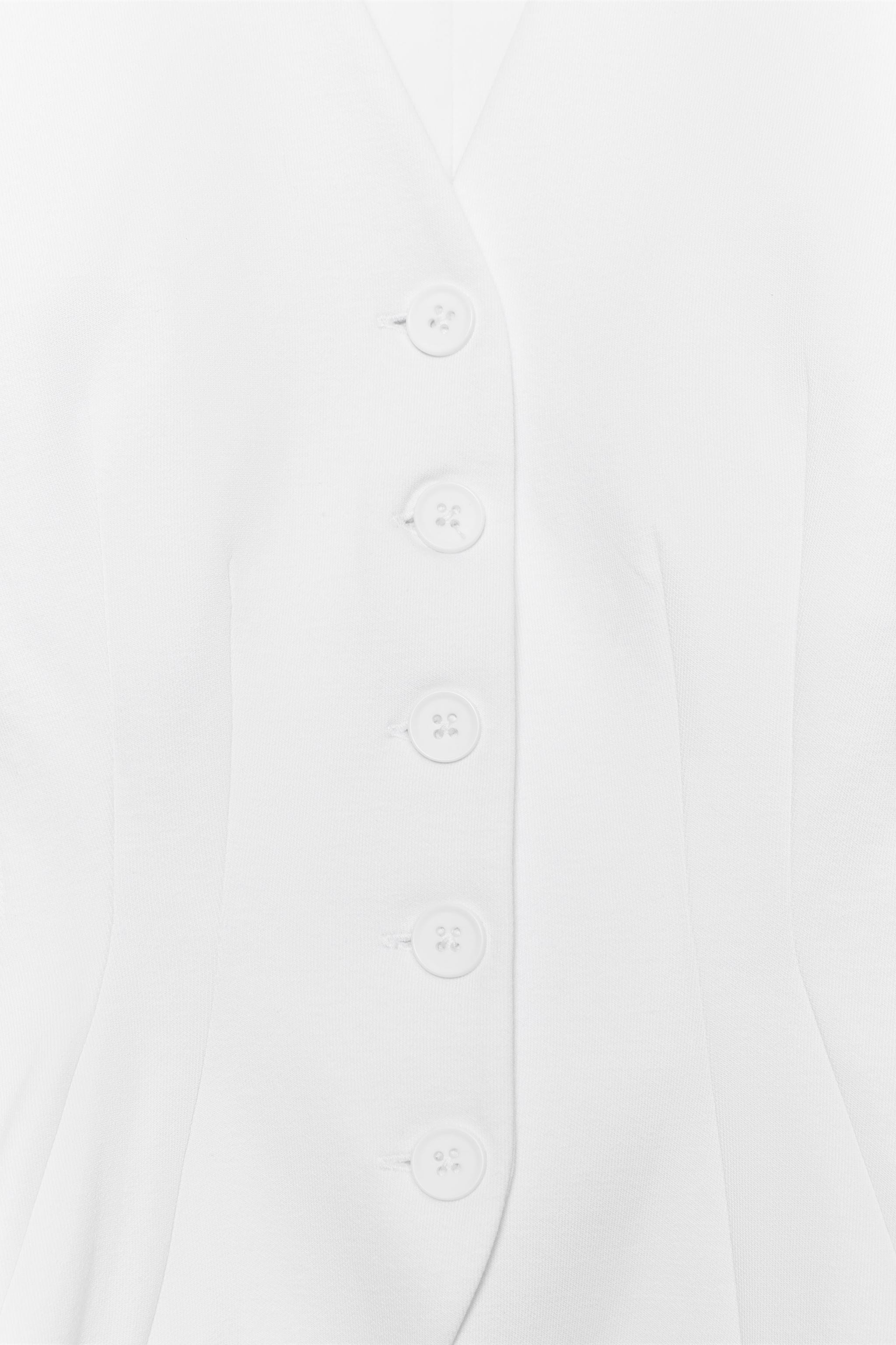 GILET INTERLOCK À BOUTONS