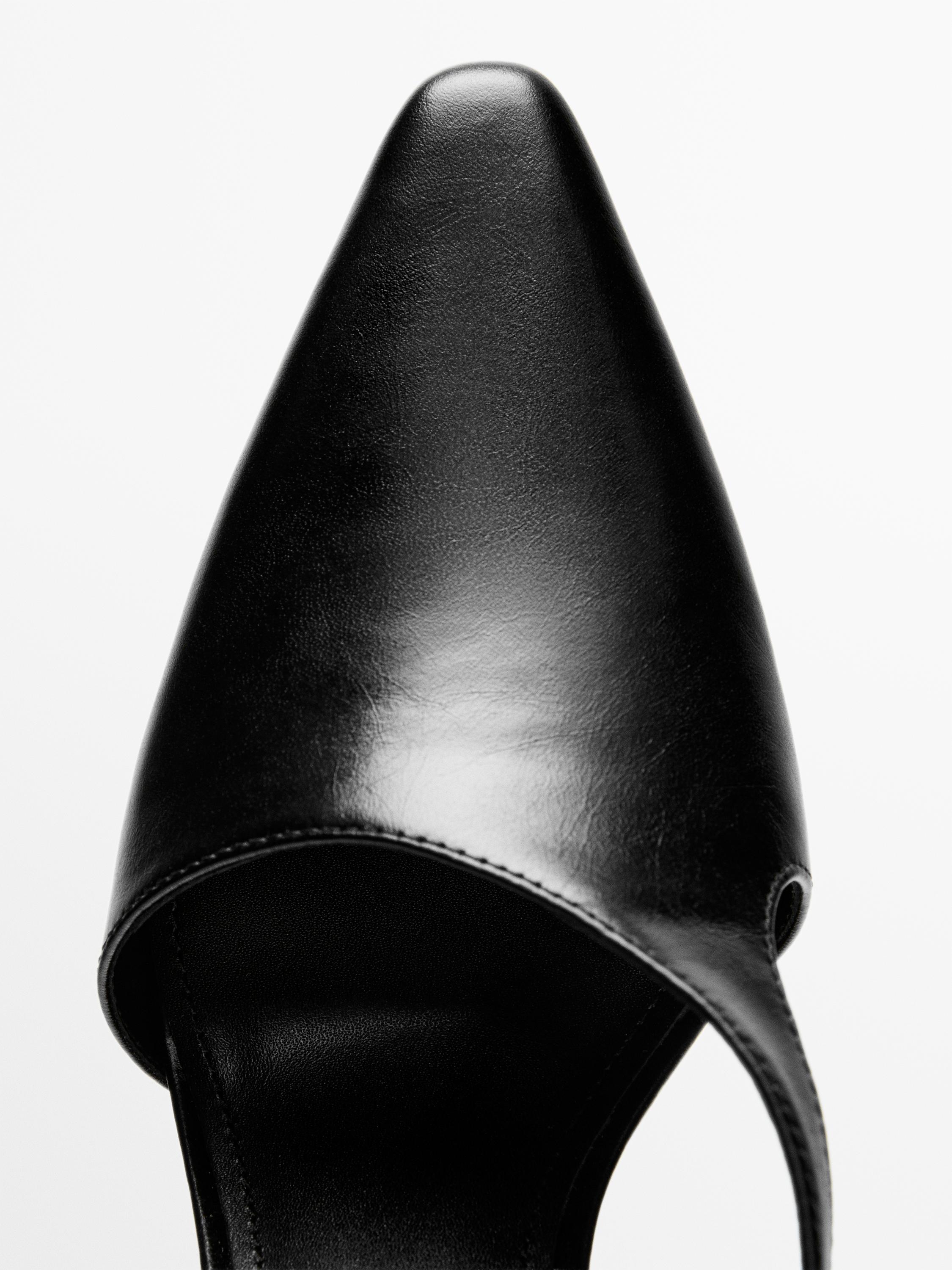 Asymmetric high-heel shoes