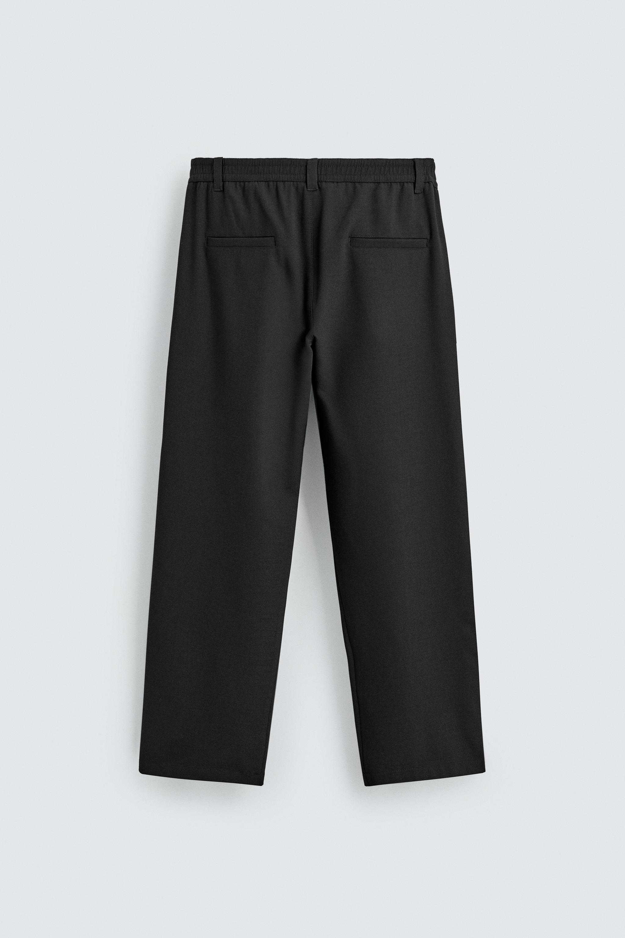 RELAXED FIT PLEATED PANTS