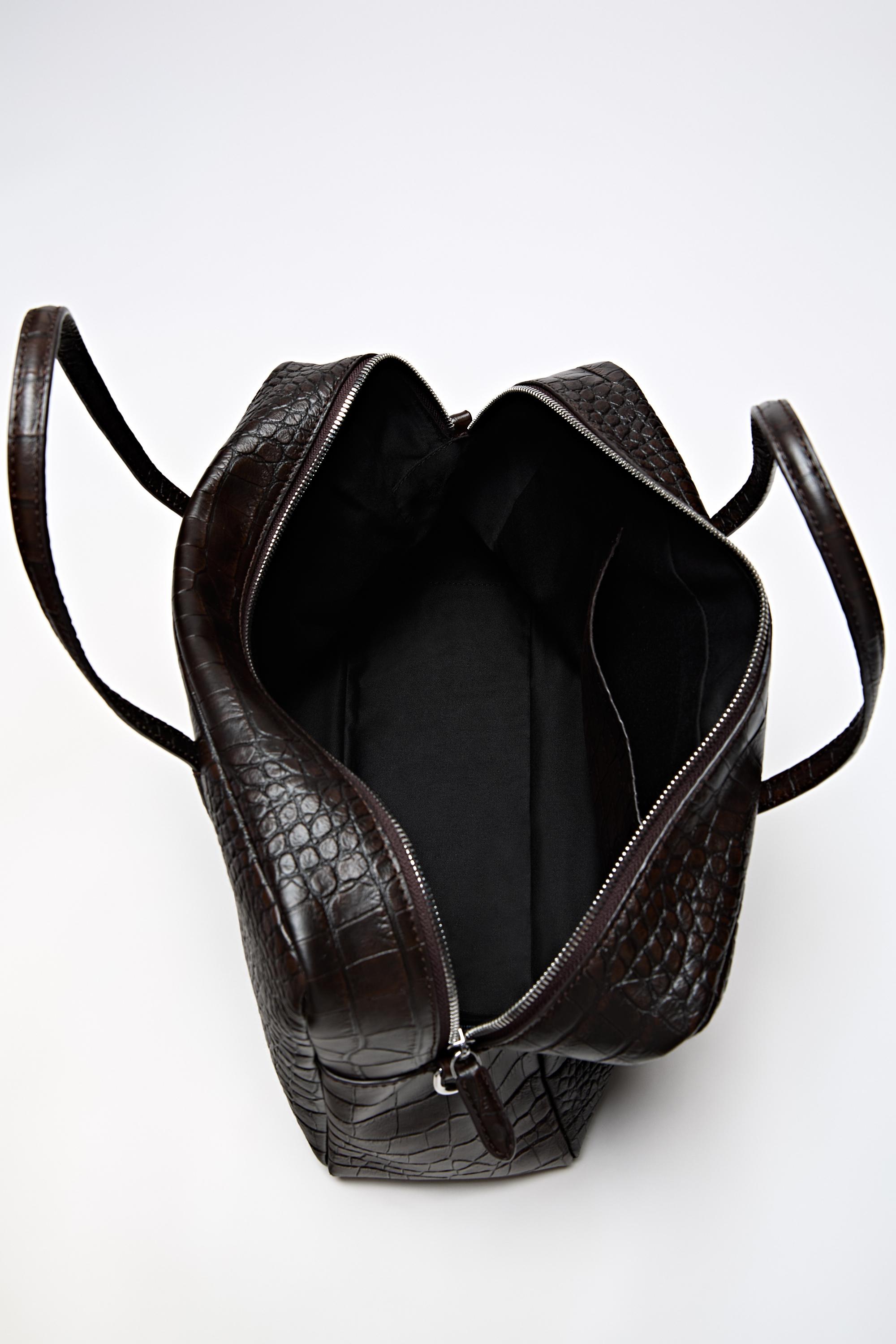 Medium leather textured duffle bag