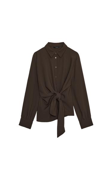 Front view of a brown shirt with a shirt collar, long sleeves, button fastening and a knot at the front.