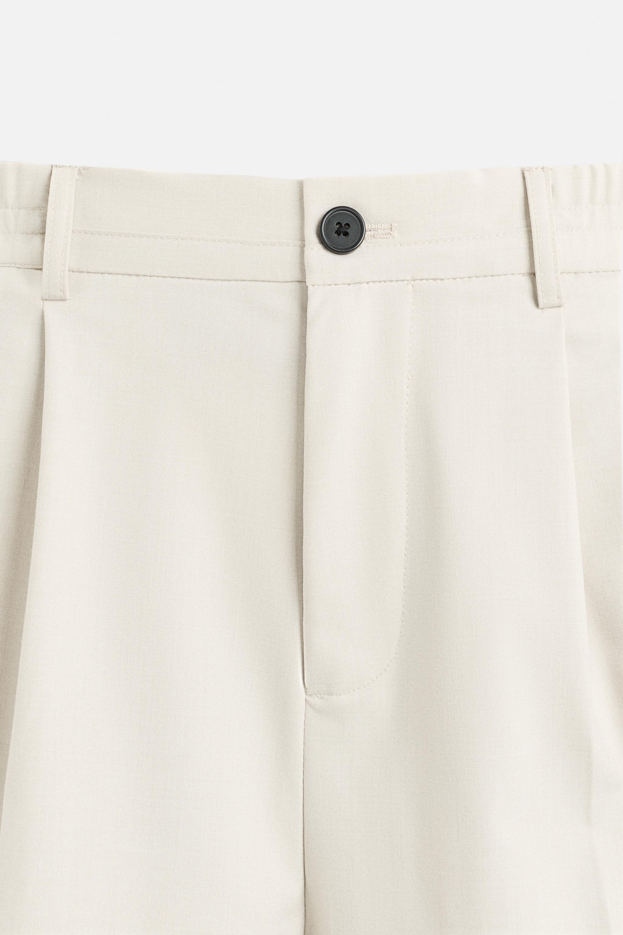 PLEATED WIDE FIT PANTS