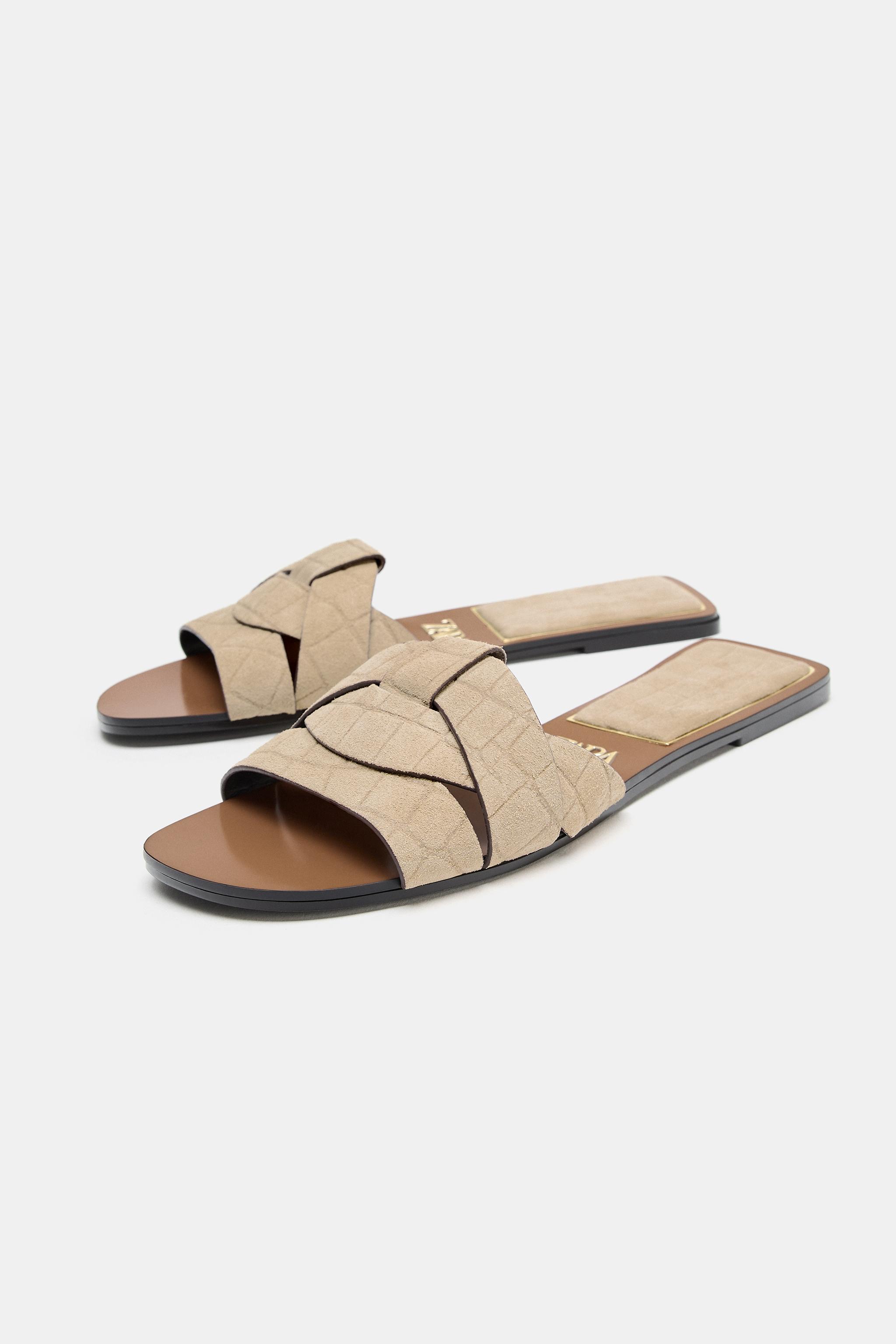 CROSSED LEATHER FLAT SANDALS