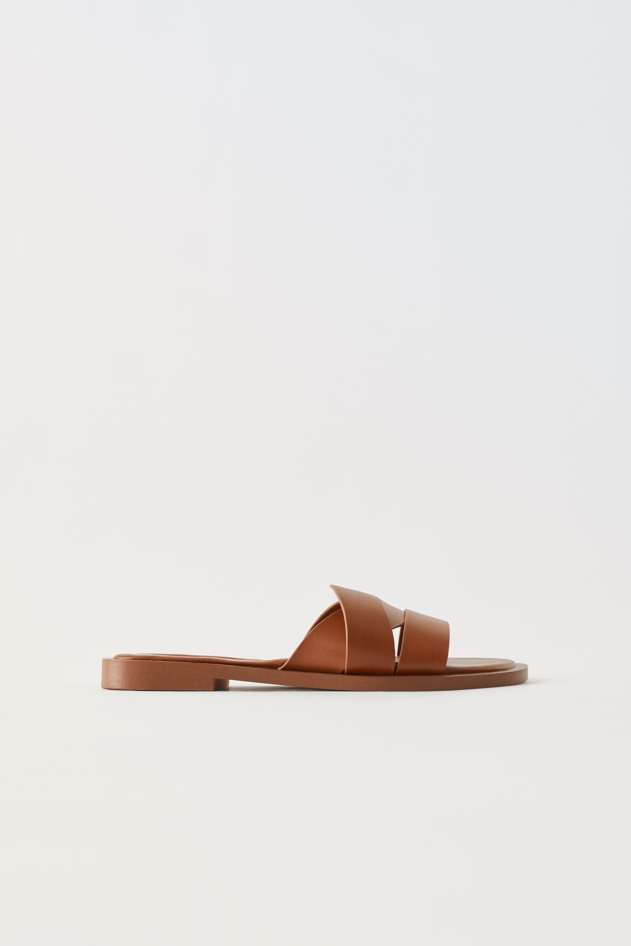 Zara Flat leather sandals with wide crisscross straps. Metal studs