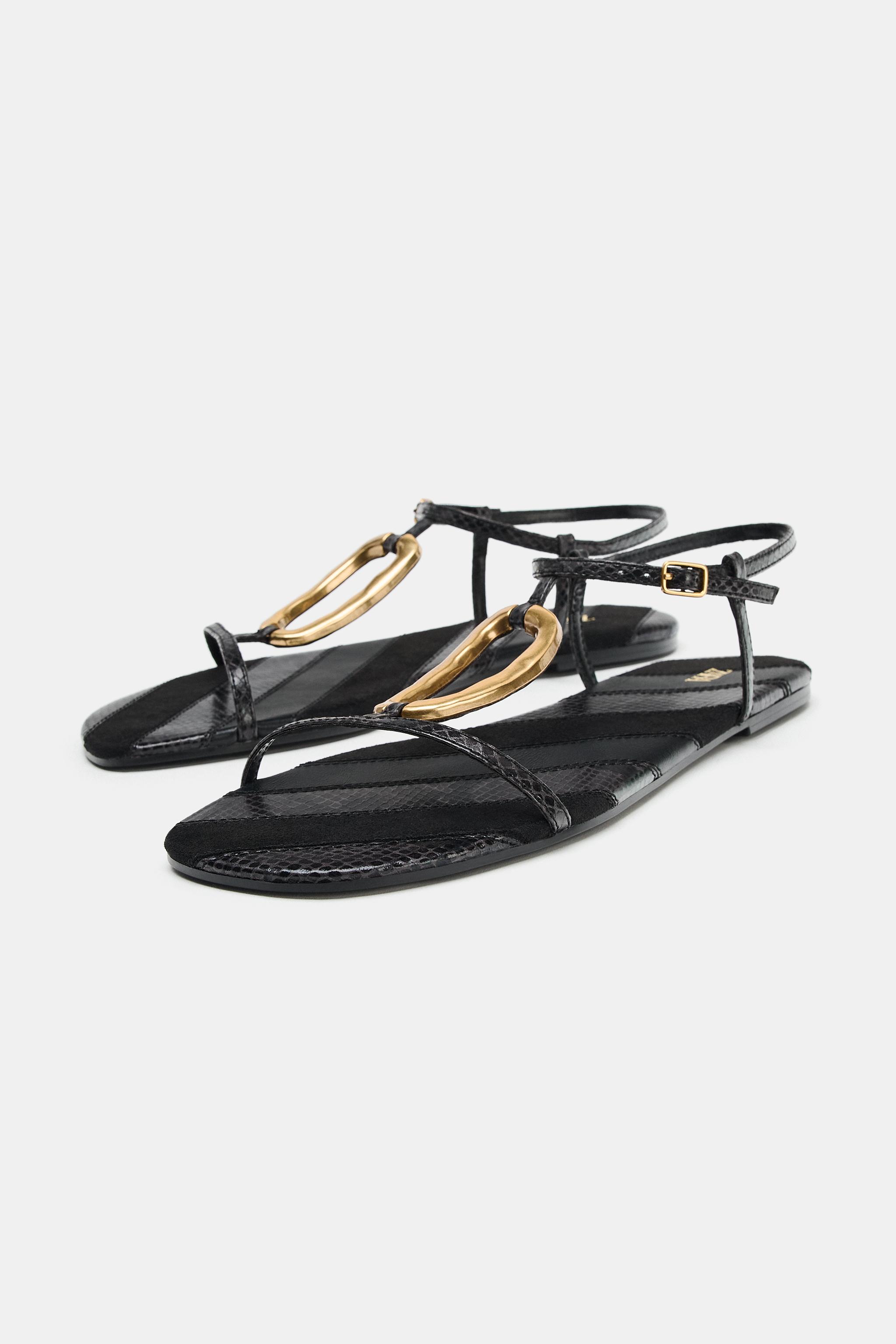 FLAT SANDALS WITH METALLIC APPLIQUÉ