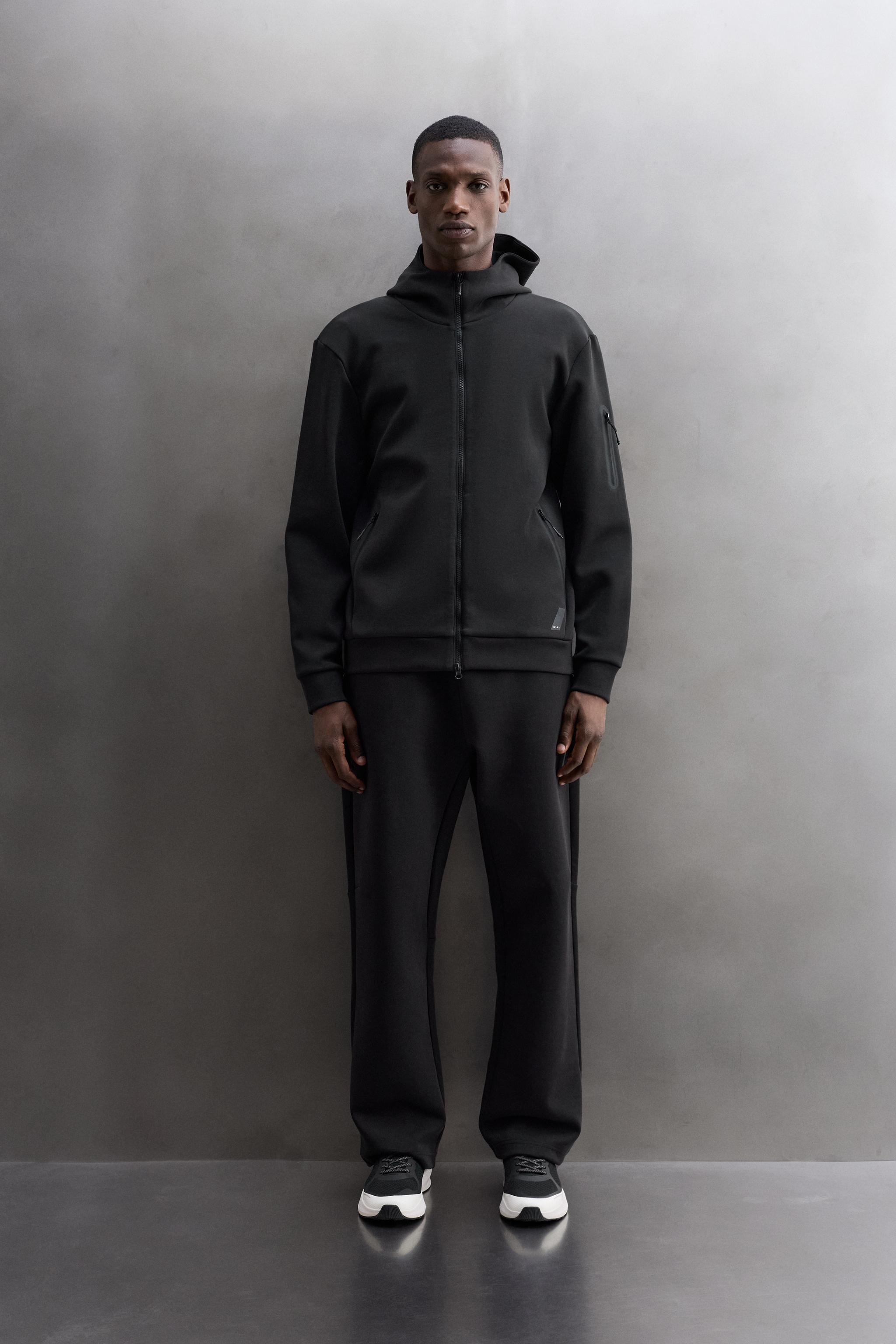 TECHNICAL ZIP-UP HOODIE