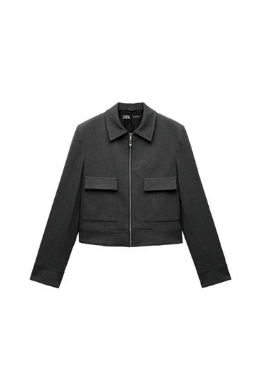 Front view of dark grey jacket with zip fastening and front flap pockets