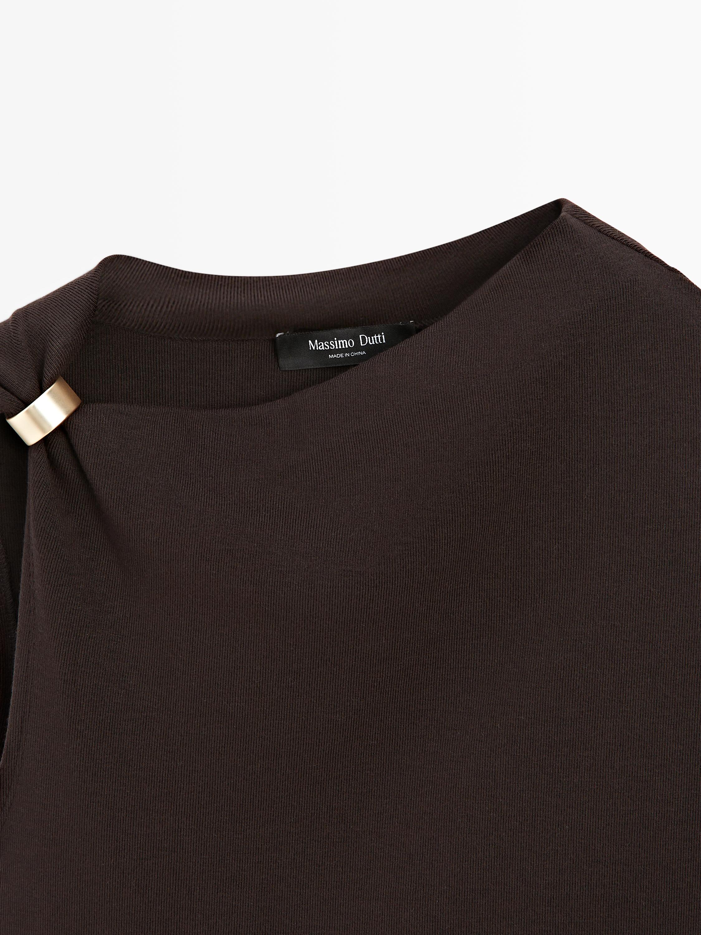 Asymmetric top with brooch detail