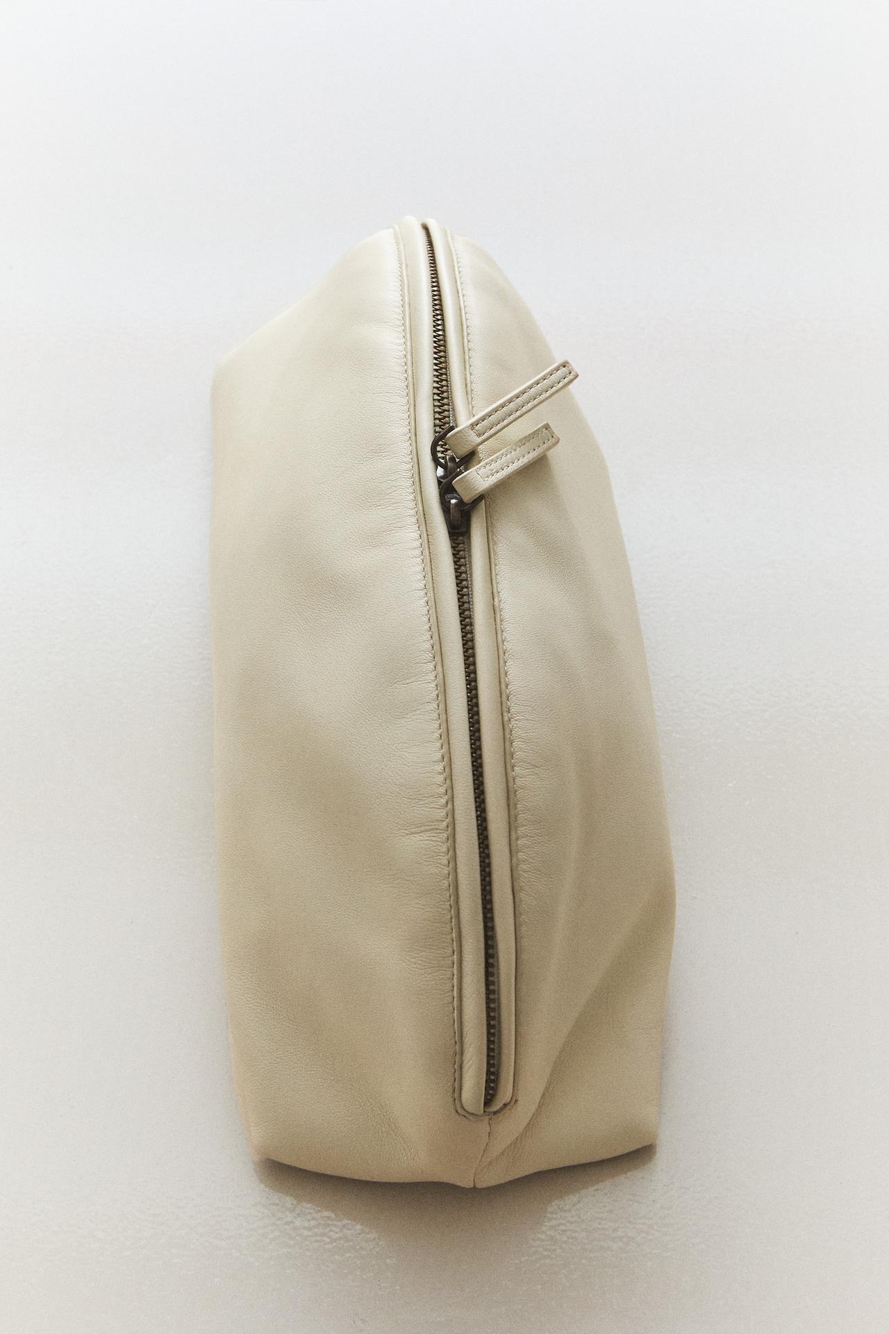 HALF-MOON NAPPA LEATHER SUEDE STEM MAKEUP BAG — 