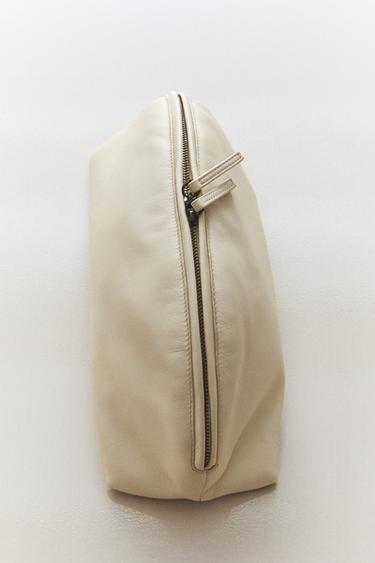 HALF-MOON NAPPA LEATHER SUEDE STEM MAKEUP BAG —  1