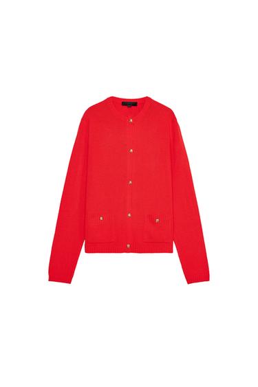Front view of a red cardigan with gold buttons and front pockets.
