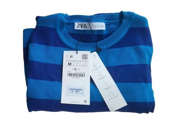 Blue and light blue striped jumper with a €17 price tag. Brand label visible on the collar.