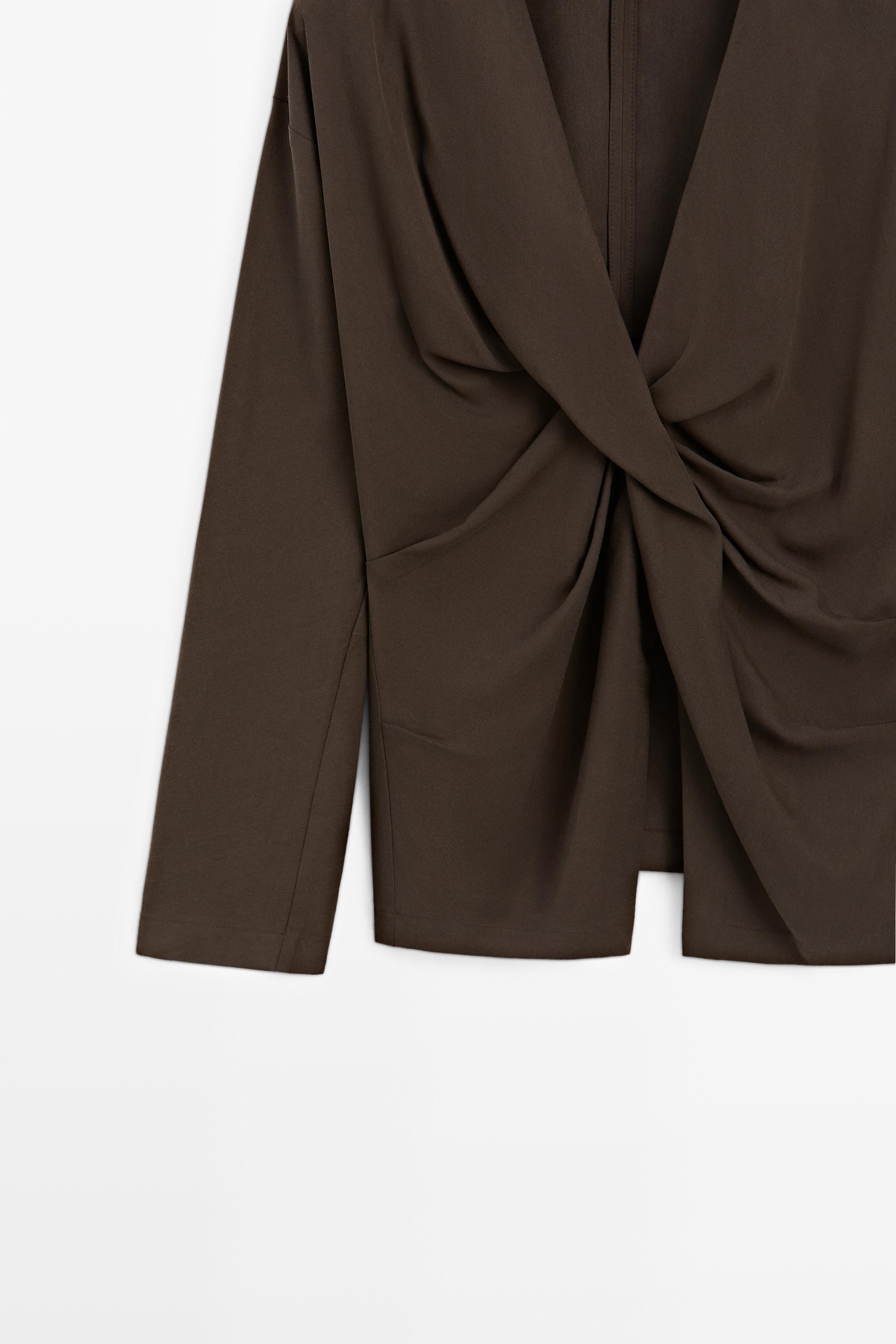Flowing blouse with draped detail