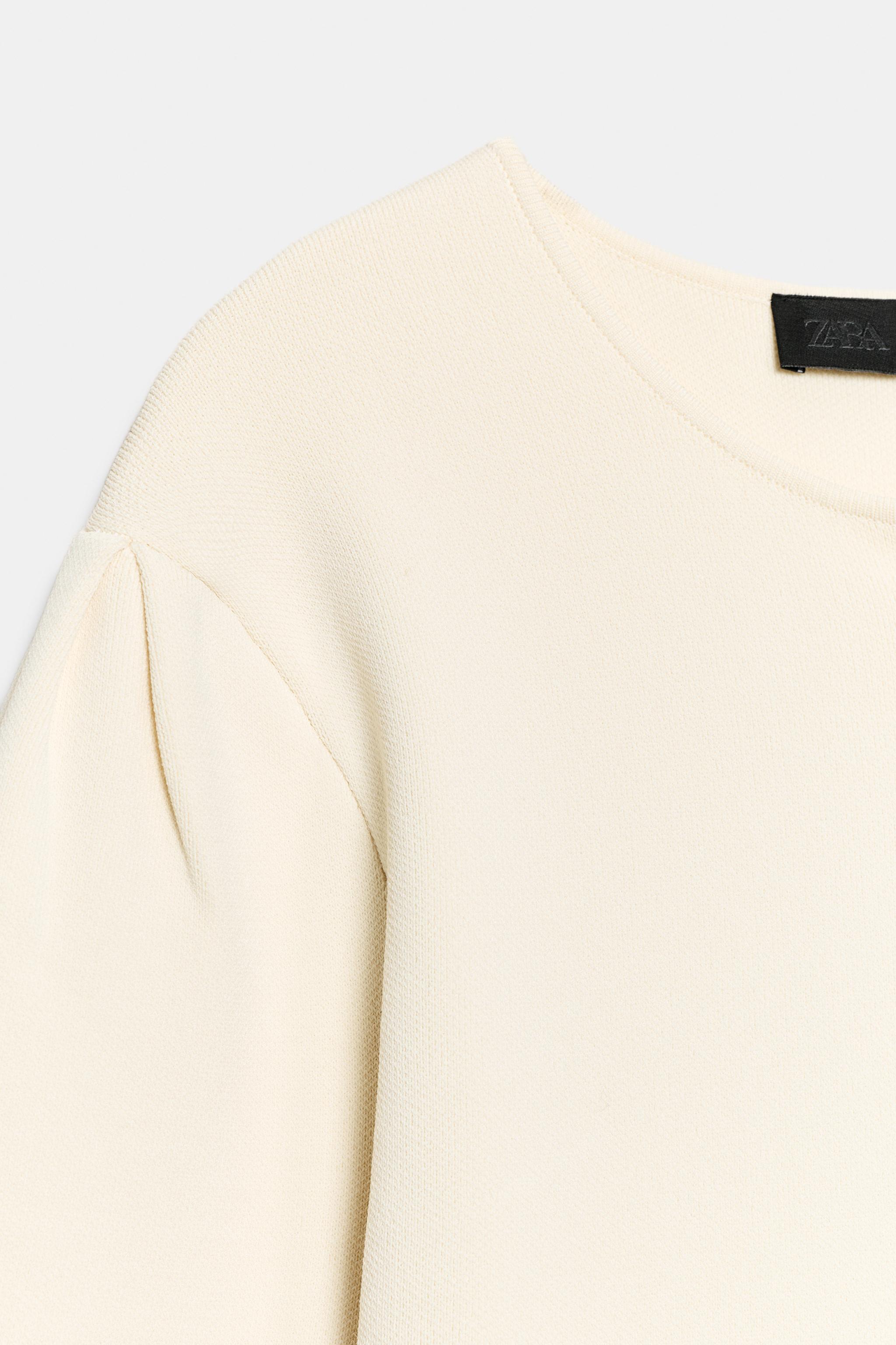 GILET EN MAILLE À MANCHES COURTES