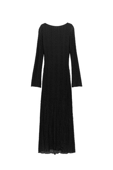 Front view of a black dress with long sleeves and a textured design.
