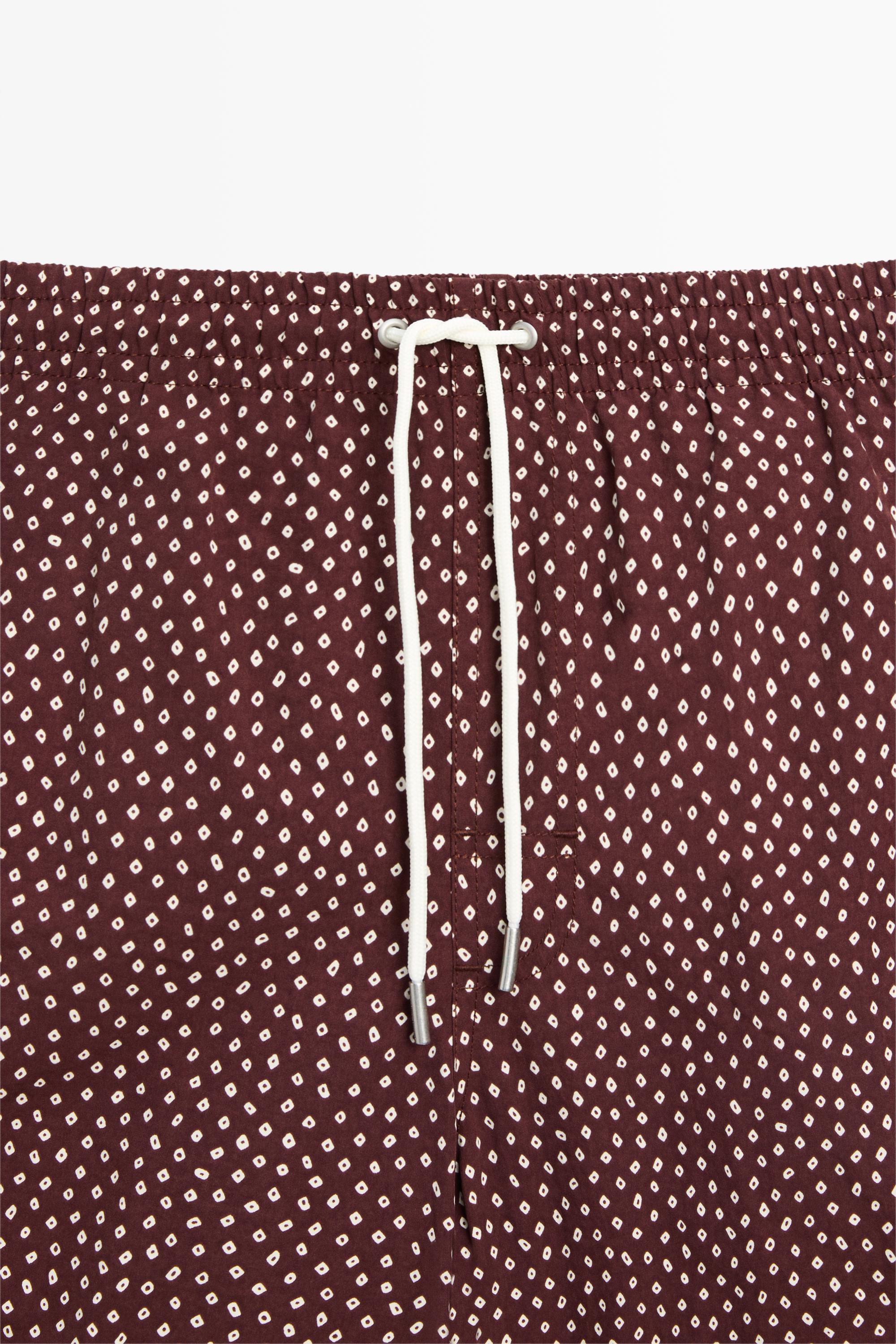 Polka dot print swimming trunks