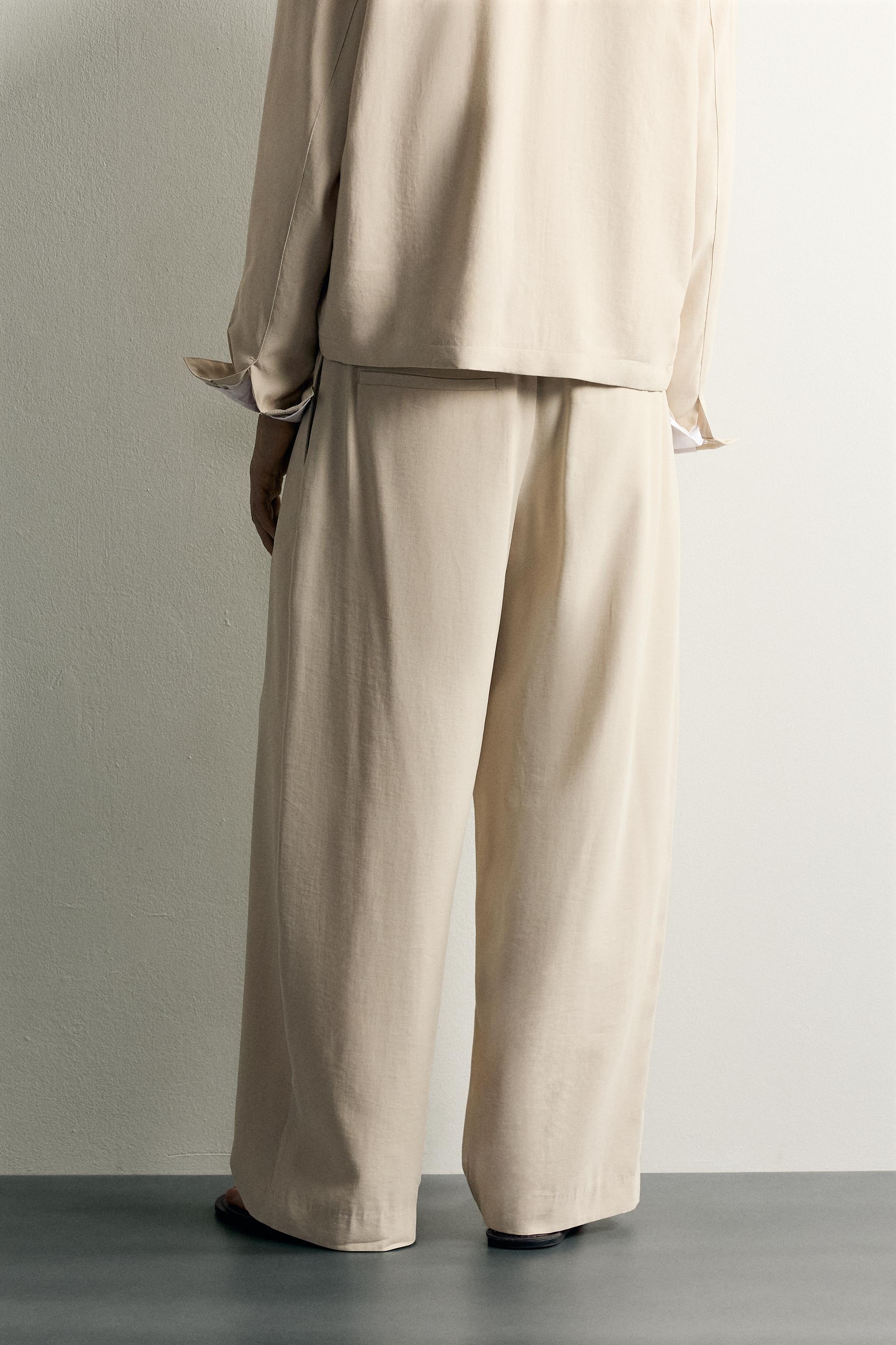 PLEATED RELAXED-FIT TROUSERS