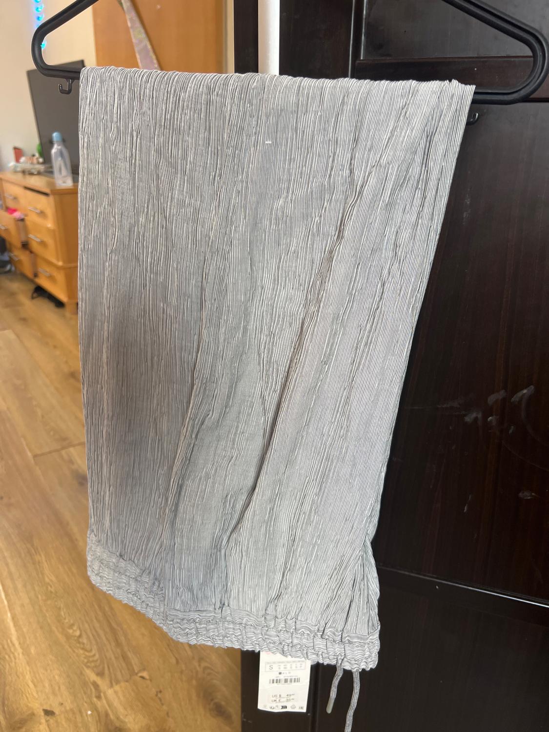 PLEATED TROUSERS