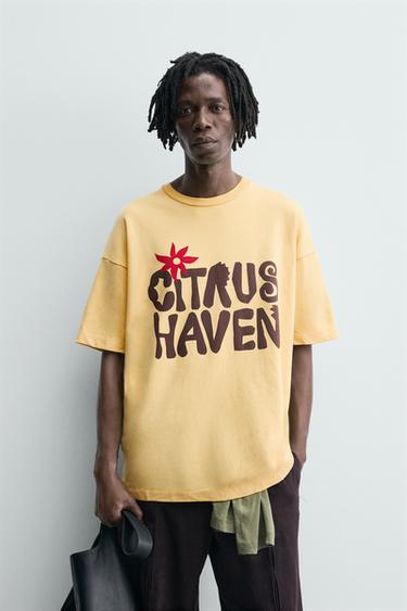 سويت شيرت بنص مطبع - أصفر داكن الخاص بـ Zara