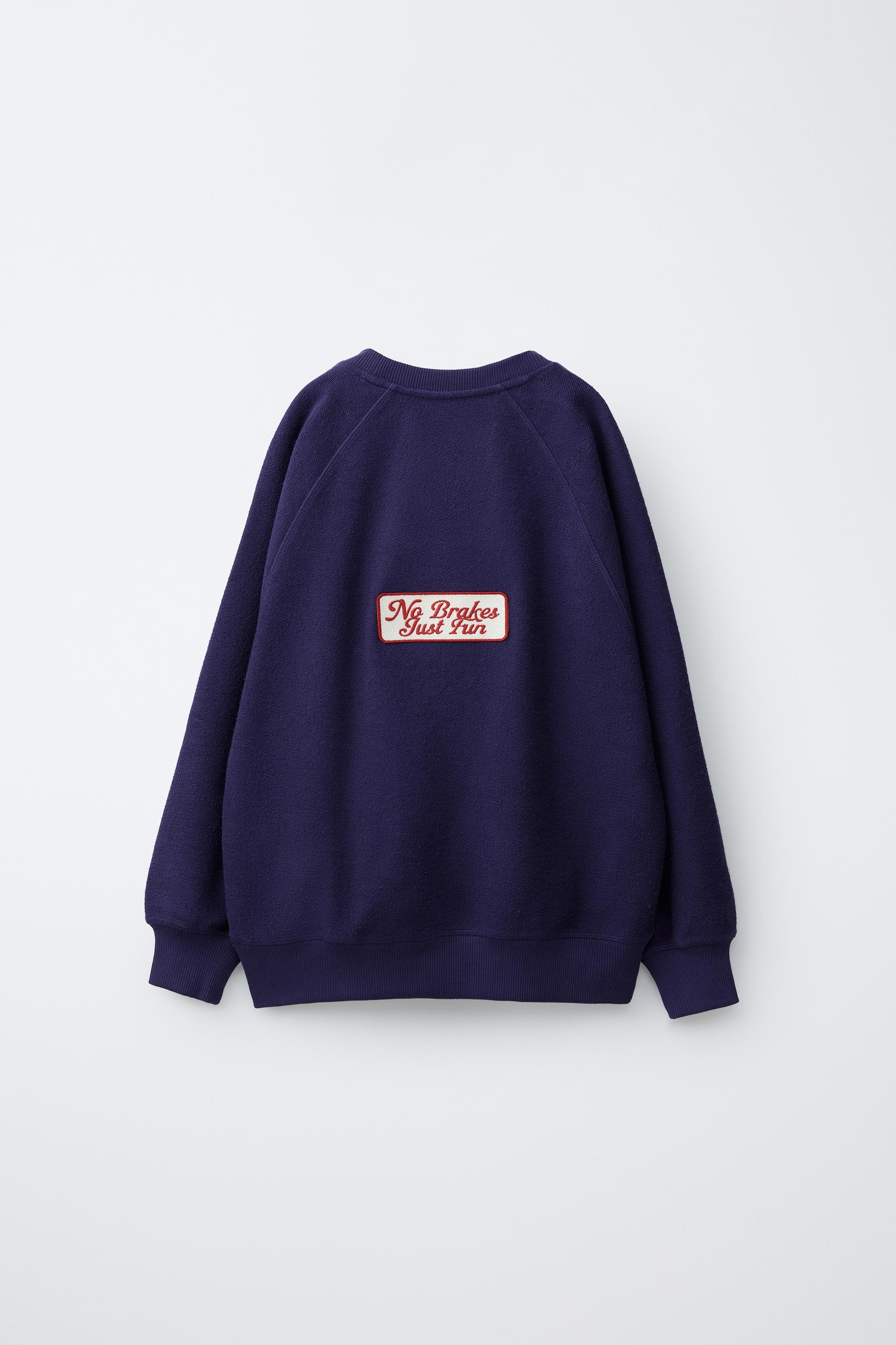 PULL EN MAILLE AVEC INSCRIPTION