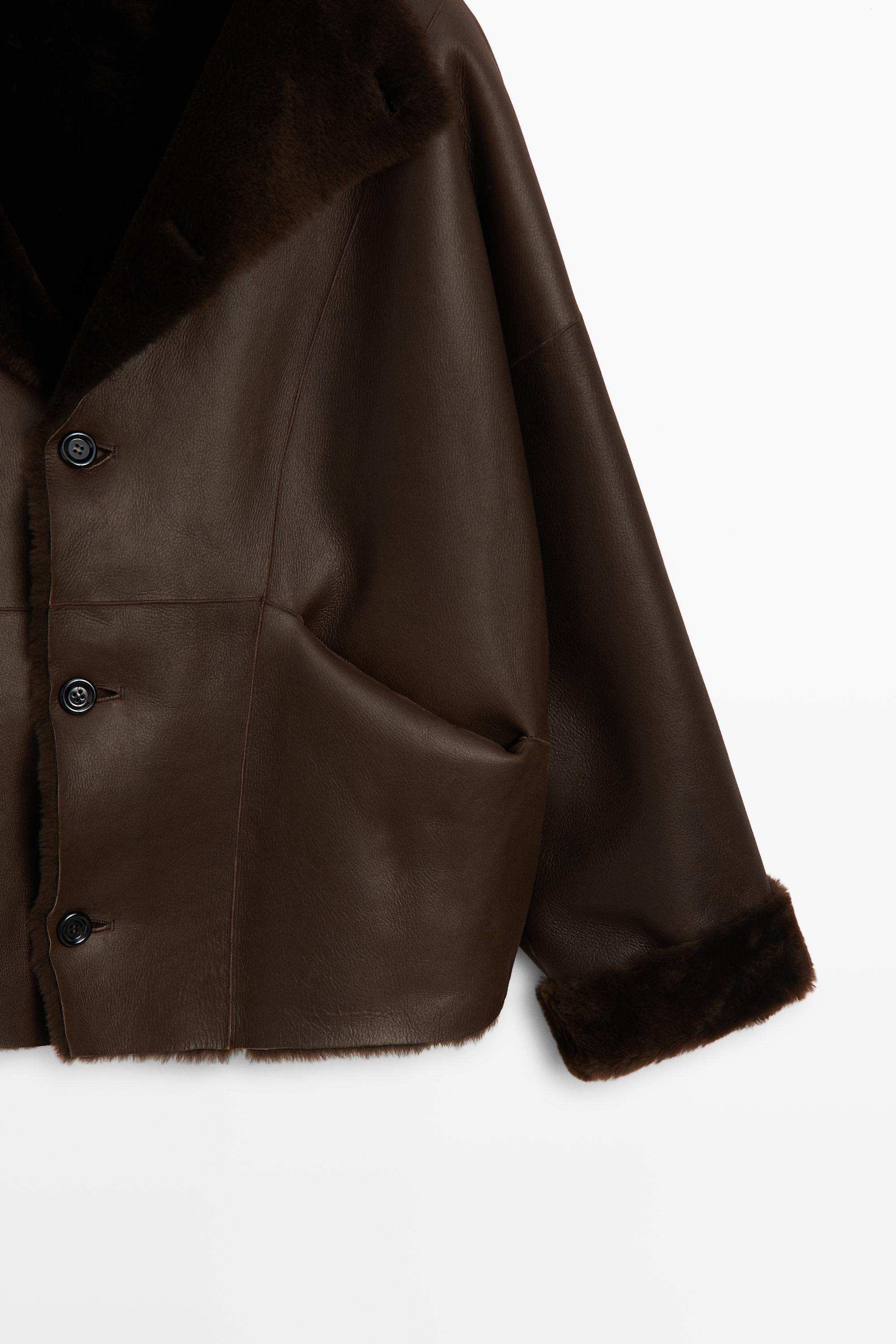 Manteau réversible en cuir avec fourrure