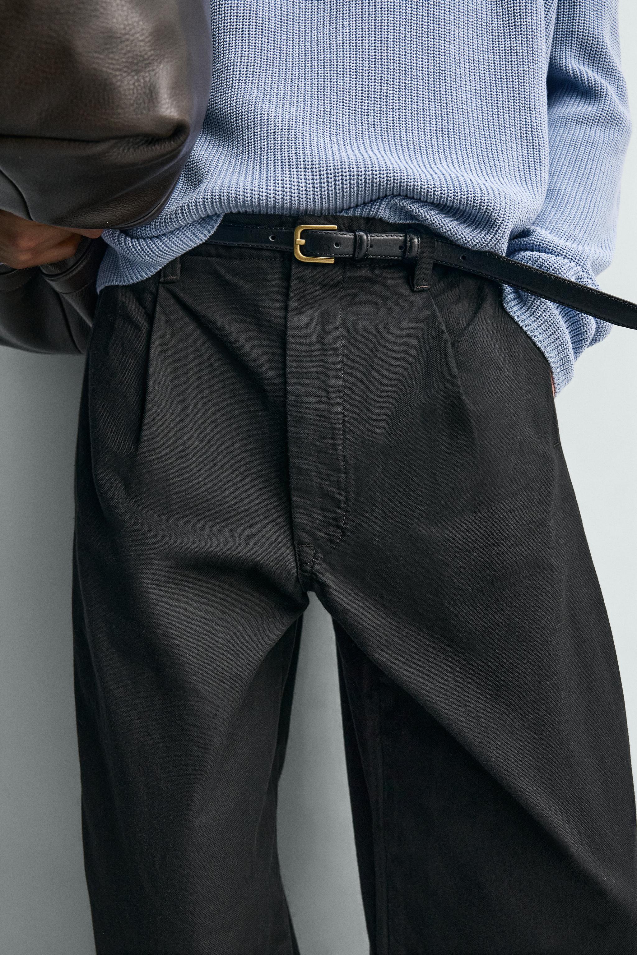 WIDE FIT PLEATED PANTS