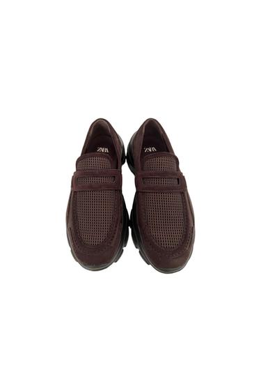 Dark brown moccasin-style shoes with mesh panels and a chunky sole on a white background. ZARA is written inside.