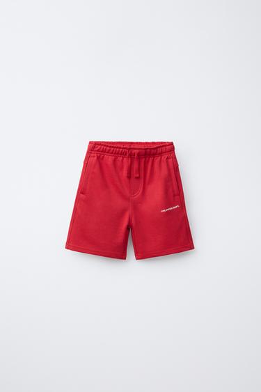 BERMUDA IN FELPA CON SCRITTA IN RILIEVO - Rosso di Zara