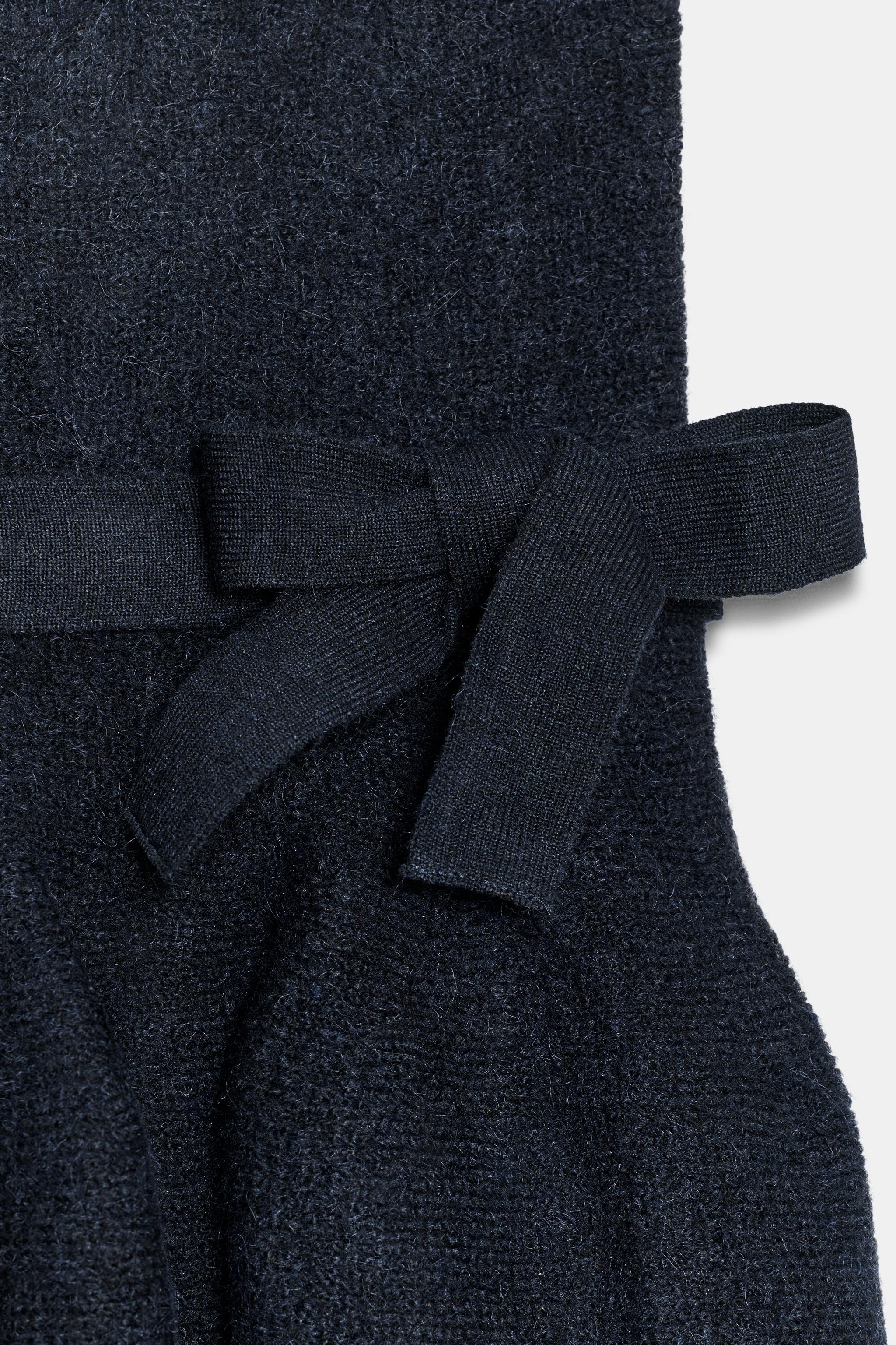 TIED KNIT PEPLUM TOP