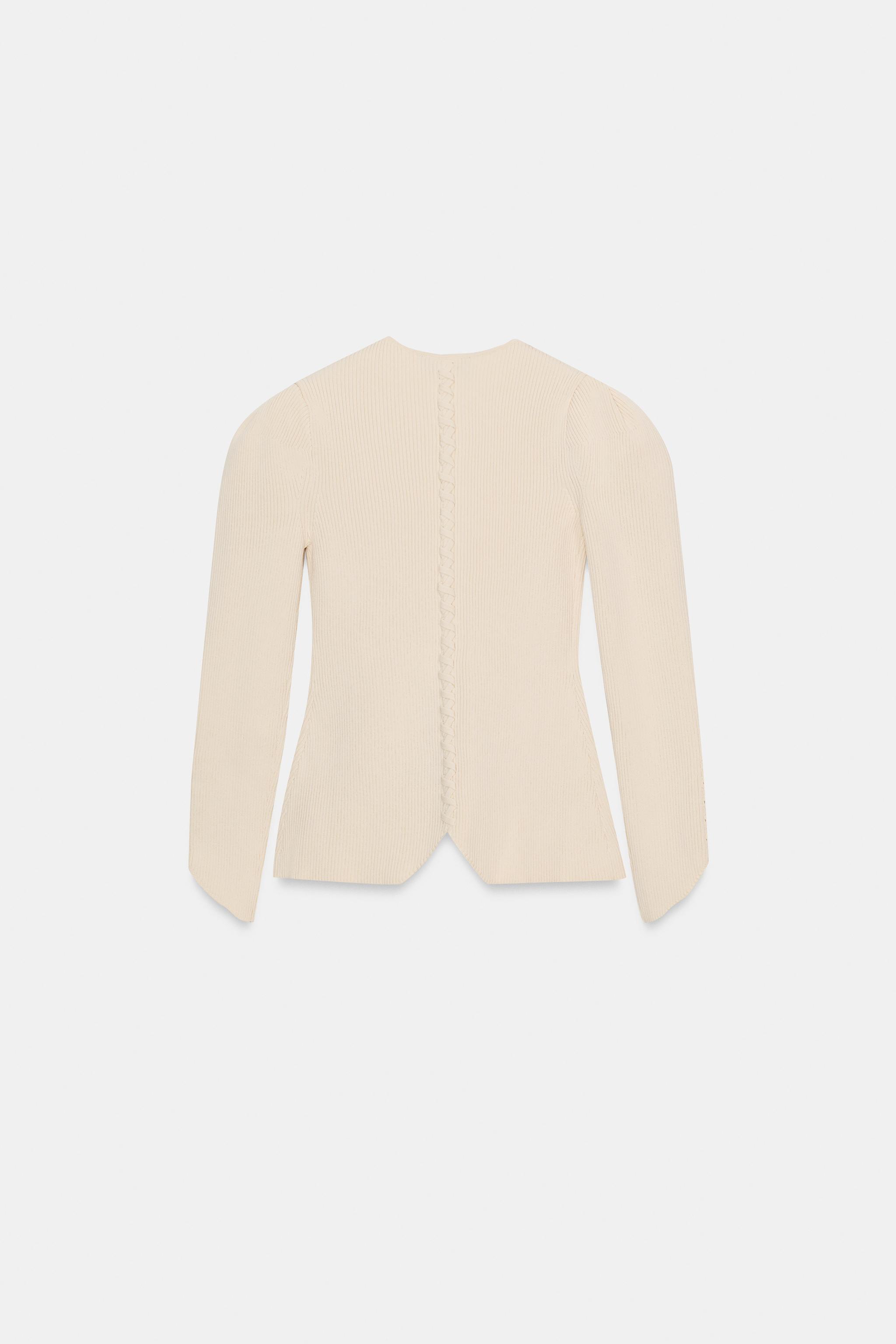 VESTE EN MAILLE À MANCHES BOUFFANTES
