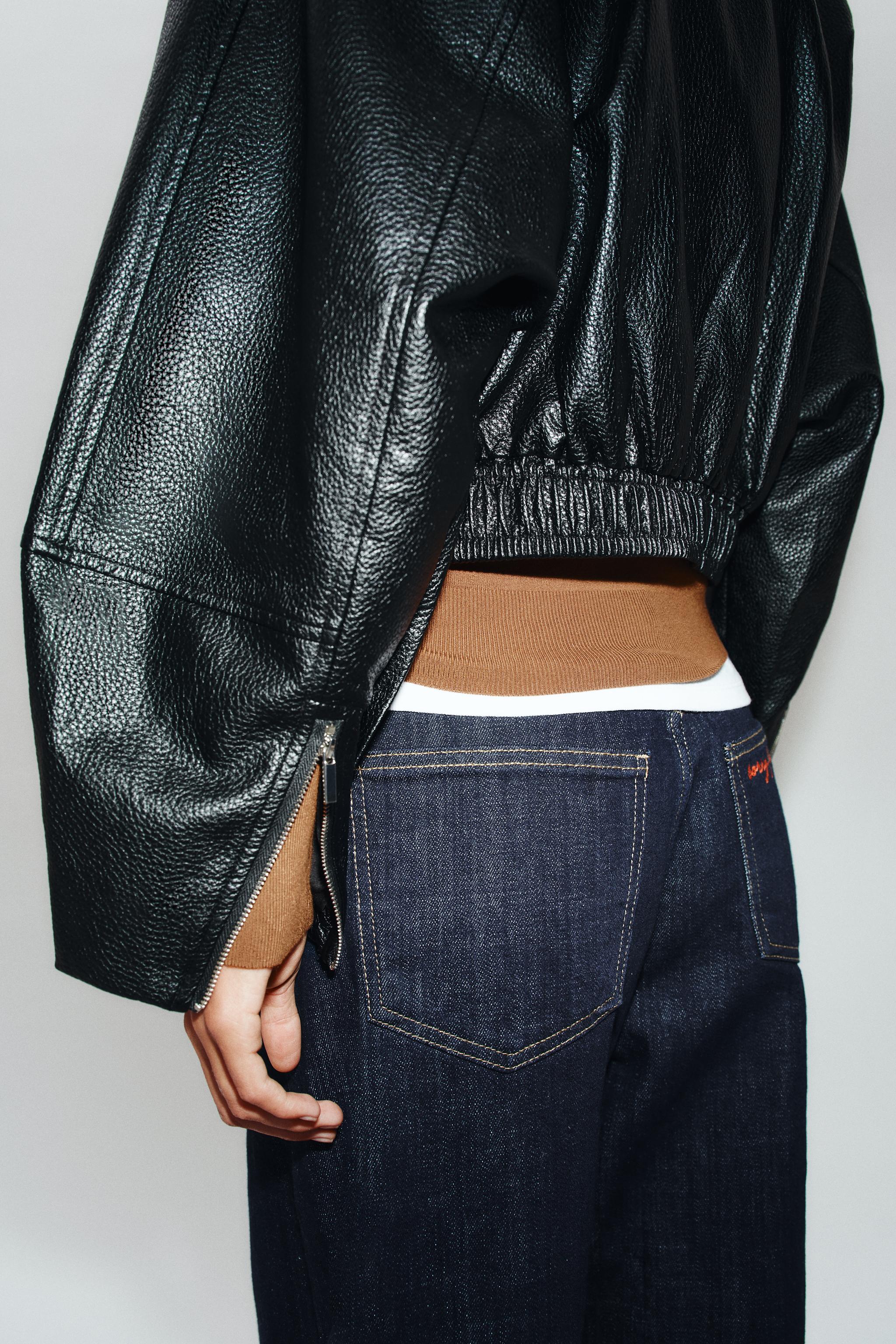 BLOUSON COURT EN MATIÈRE SYNTHÉTIQUE