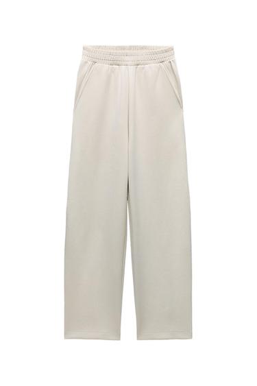 INTERLOCK BELTED BELL BOTTOM TROUSERS