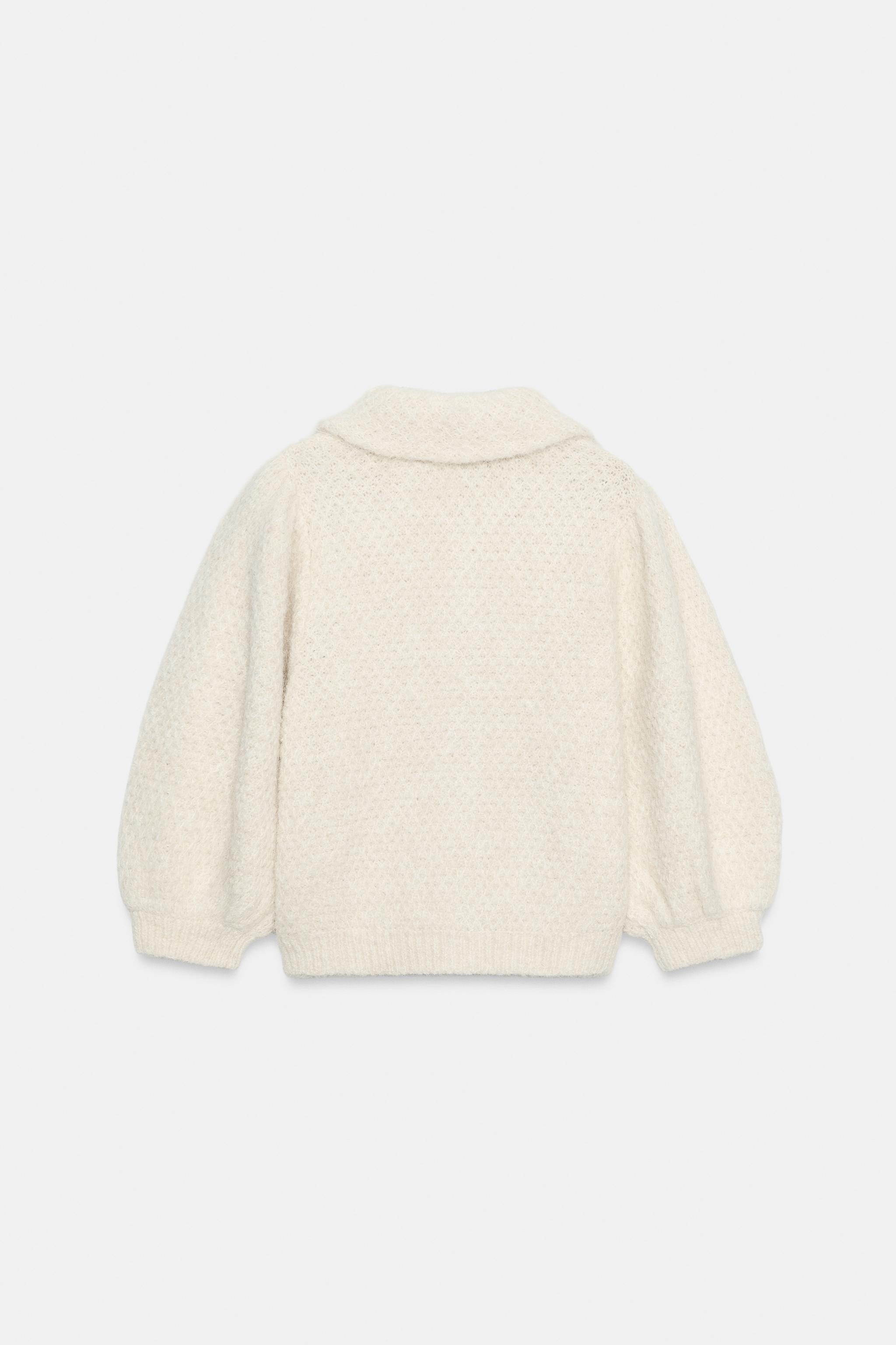 VESTE EN MAILLE À MANCHES BOUFFANTES