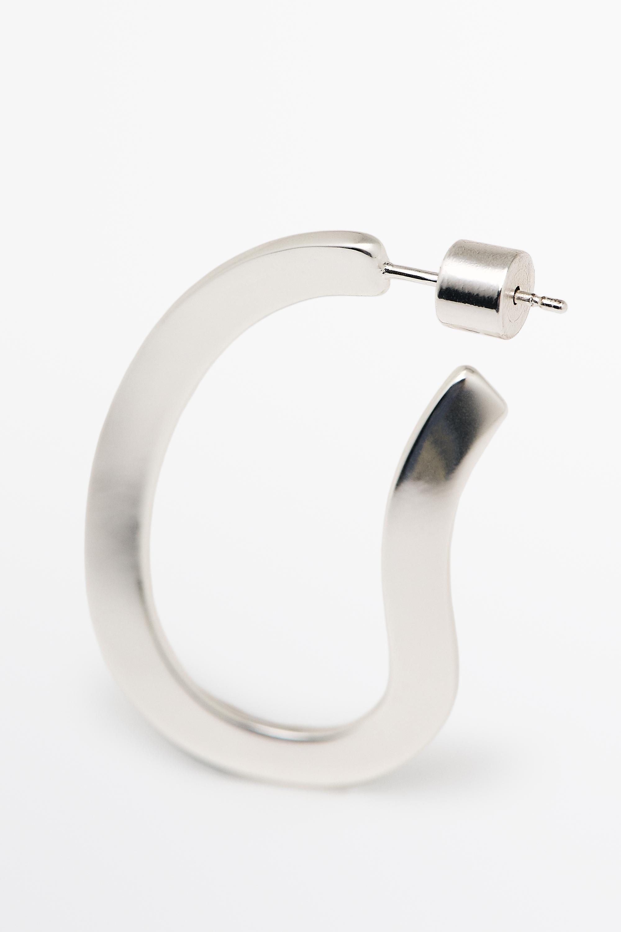 Boucles d’oreilles créoles ovales incurvées