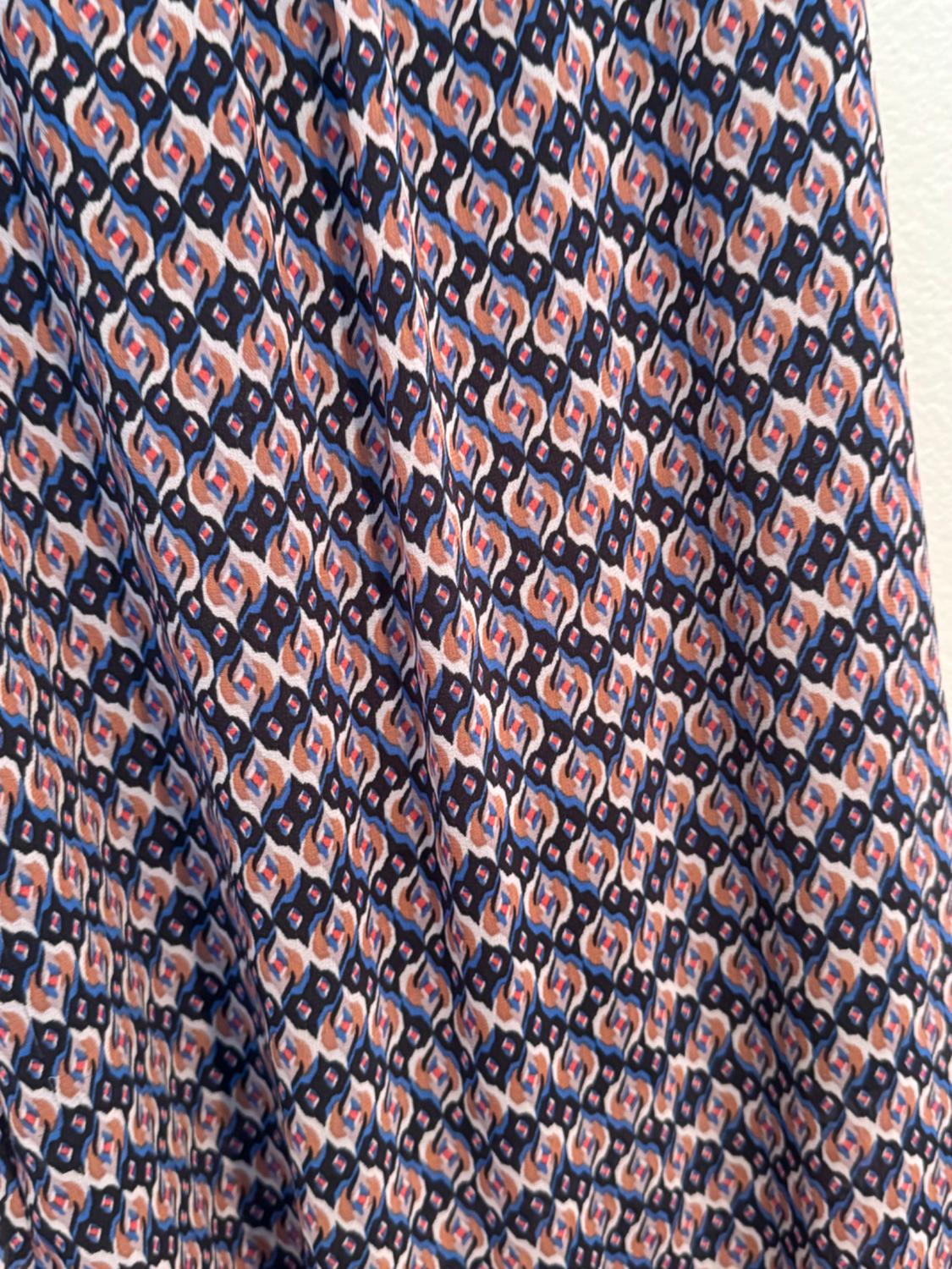 Detail of a multi-coloured geometric print on a garment.