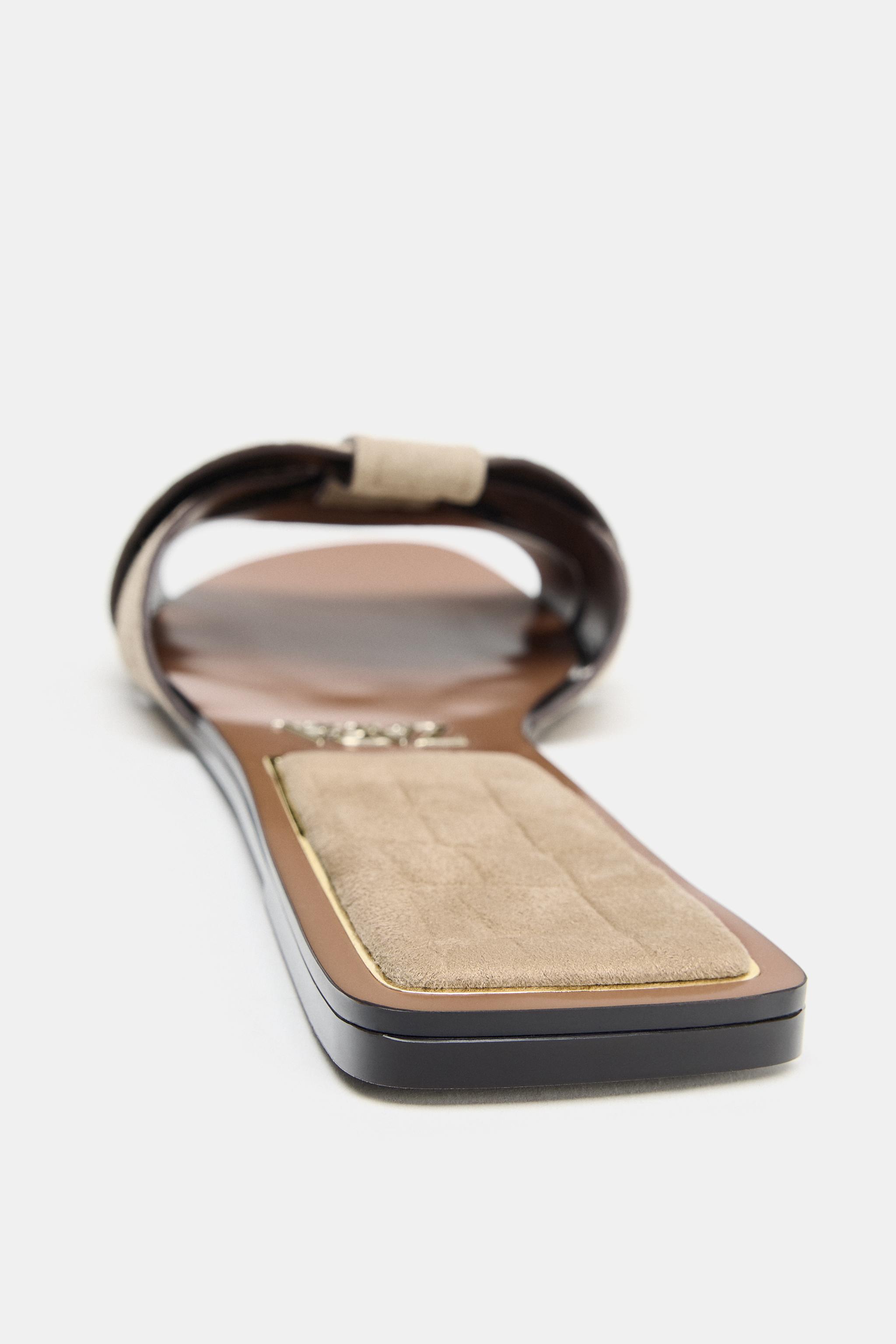 CROSSED LEATHER FLAT SANDALS