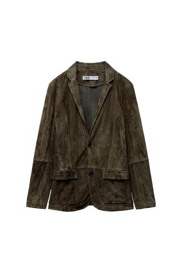 Brown suede jacket with lapels and two front buttons. Visible brand label inside. White background.