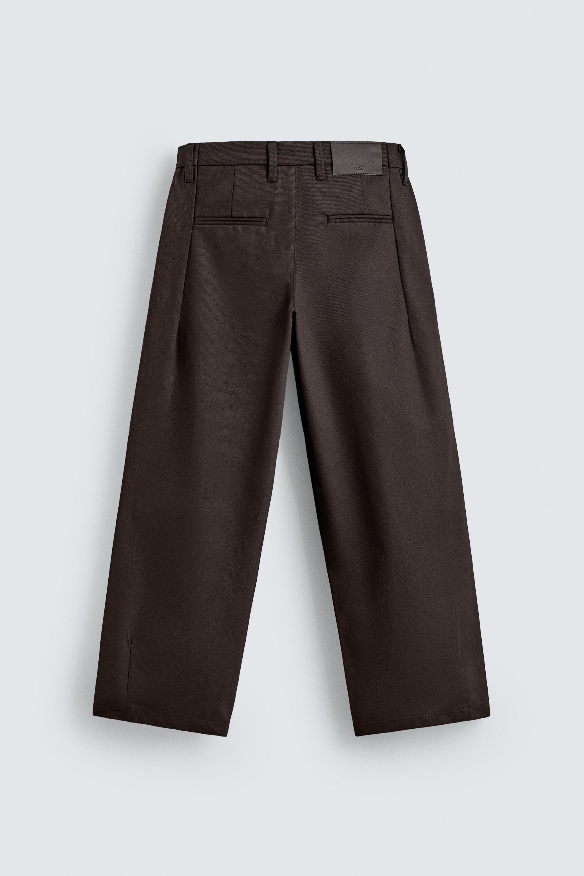 PLEATED CHINO PANTS