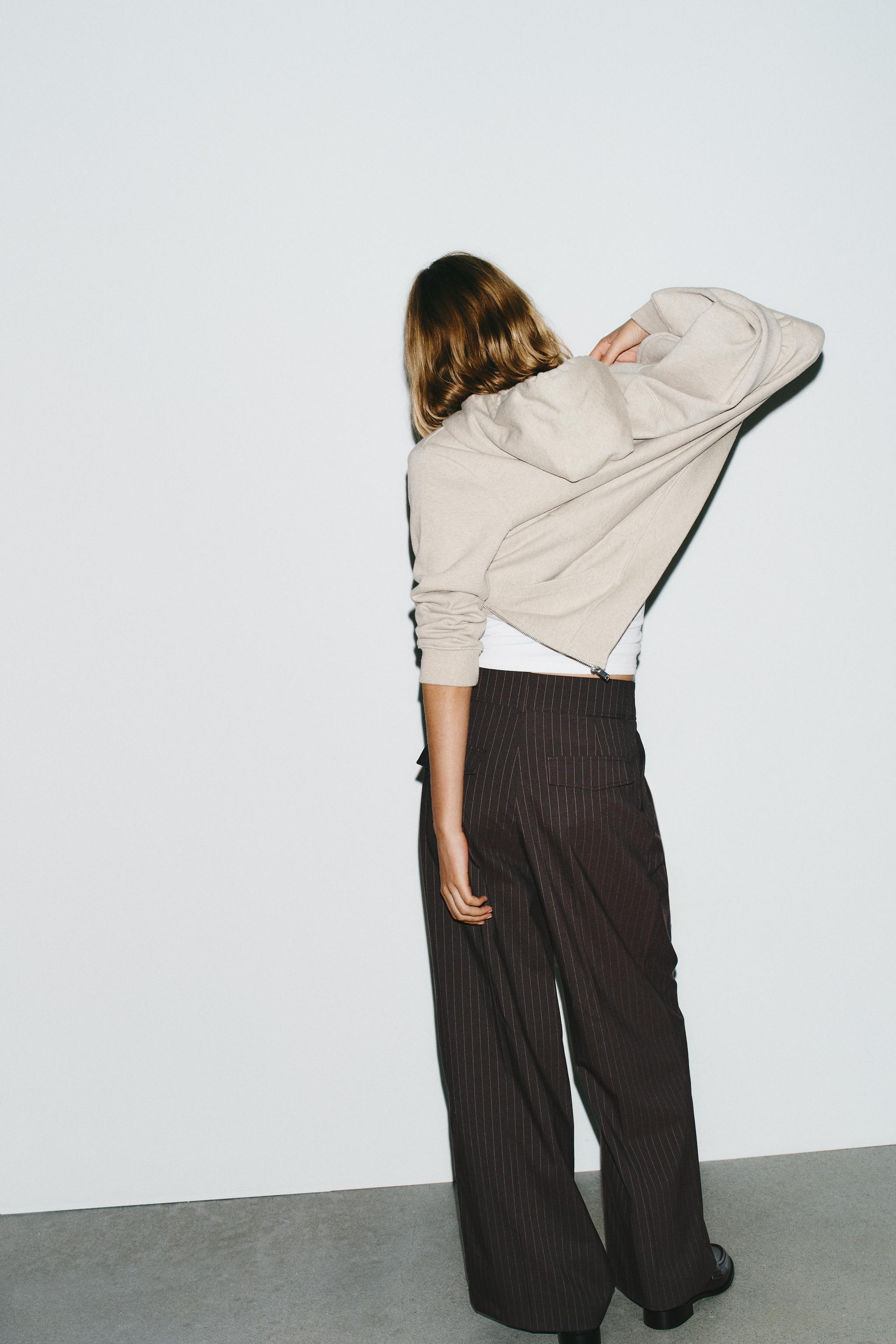 PINSTRIPE PANTS WITH PLEATS AND FLAPS