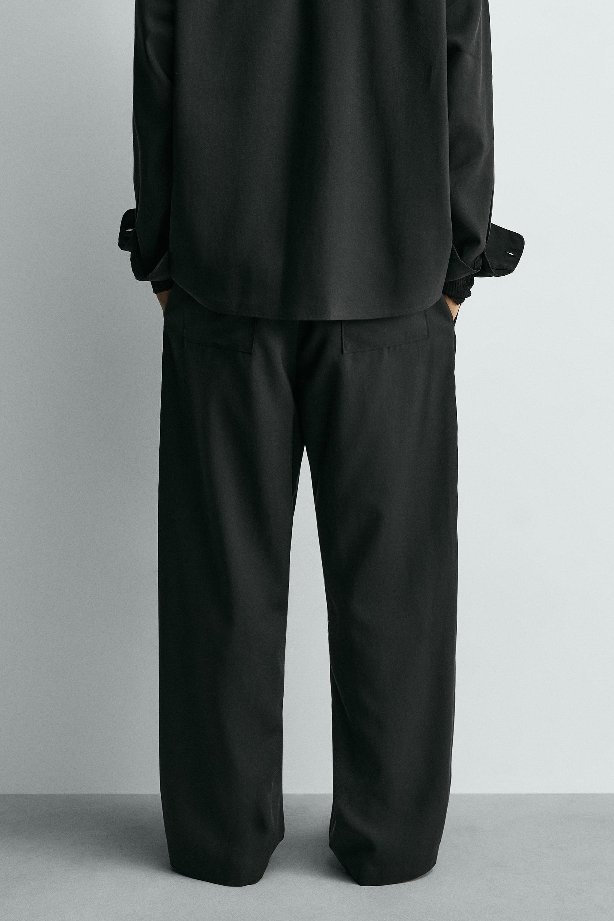 FLOWY PLEATED PANTS