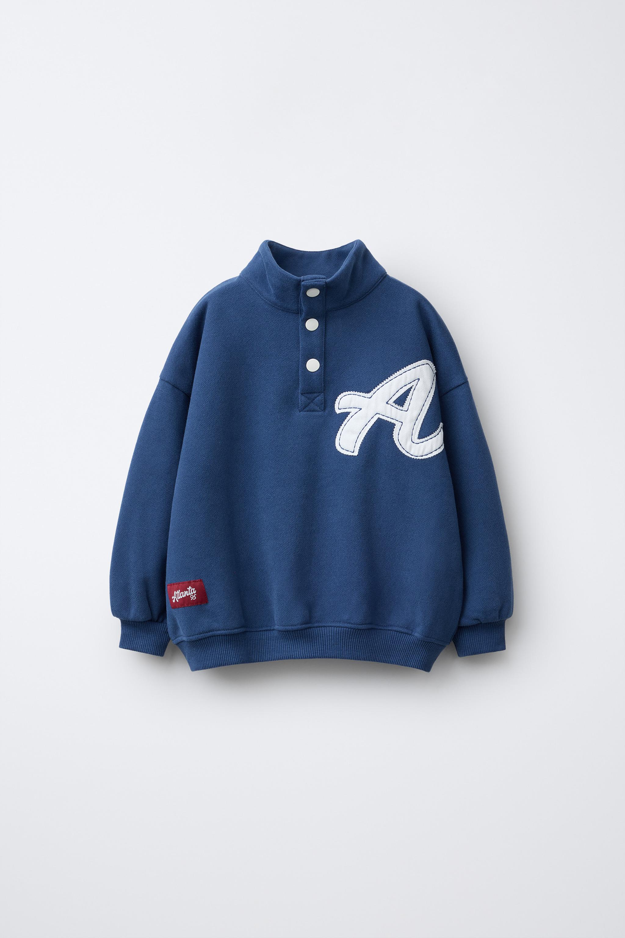 SWEAT AVEC PIÈCE LETTRE