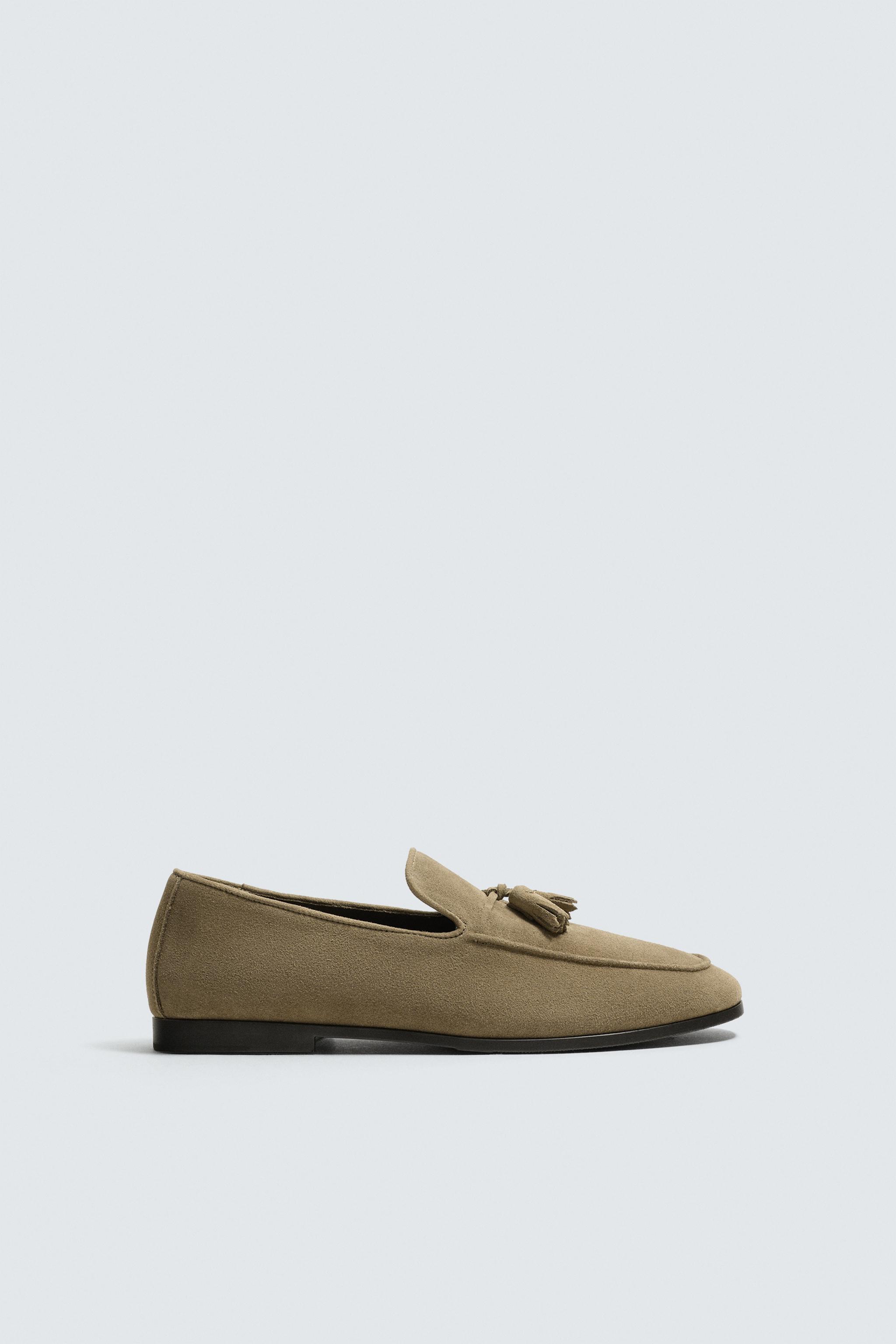 MOCASSINS EN CUIR À POMPONS
