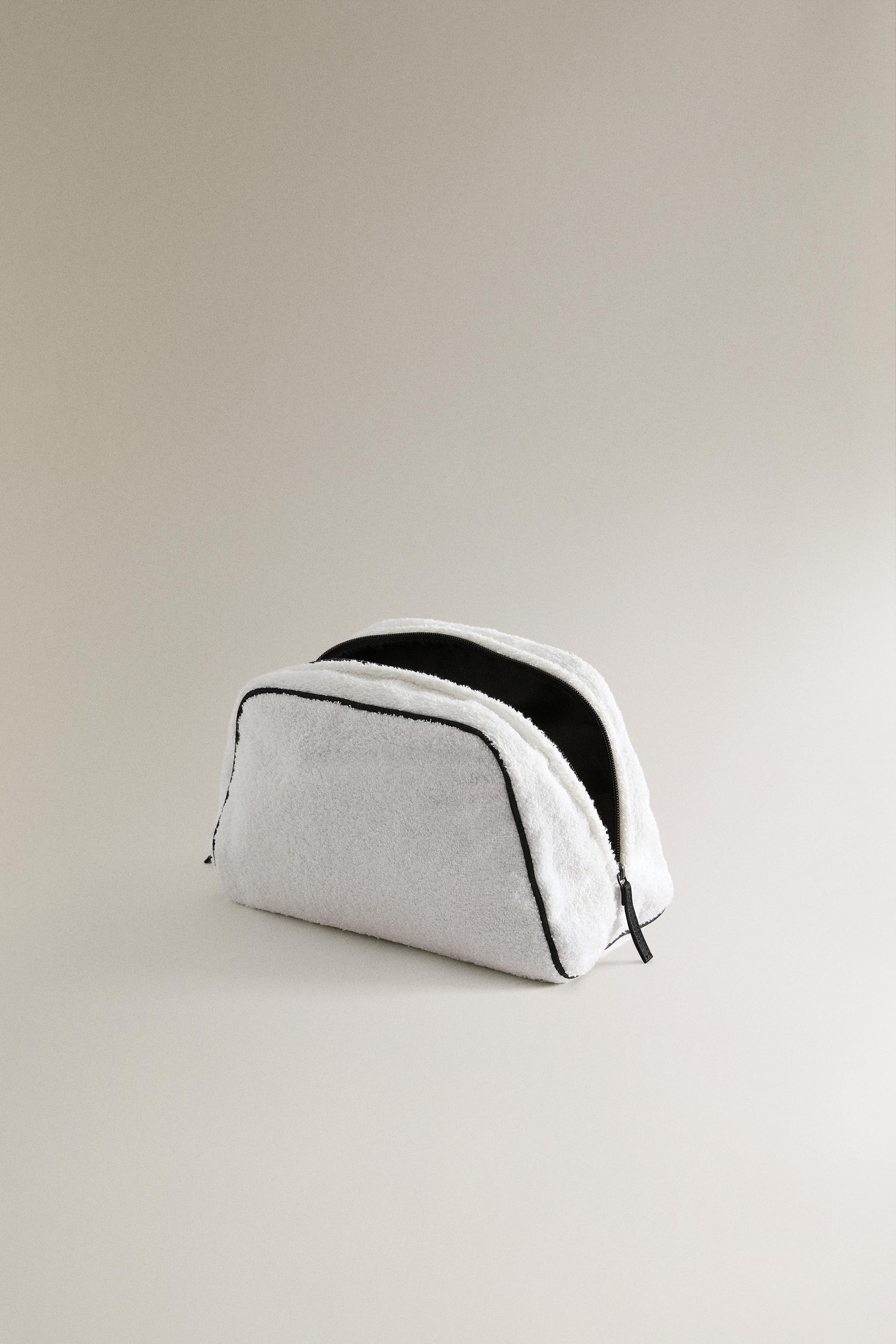 TERRY CLOTH TOILETRY BAG WITH PIPING DETAIL