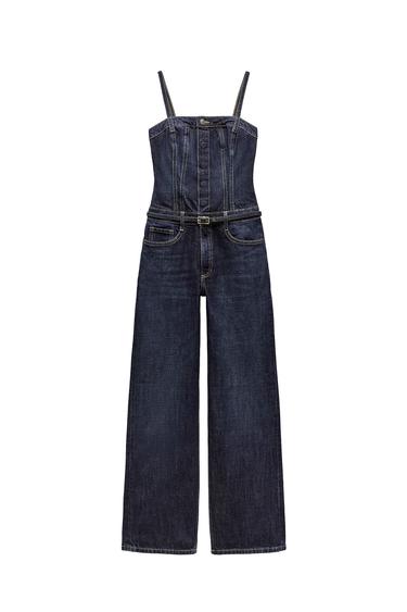 Front view of dark blue denim dungarees with thin straps and front pockets.