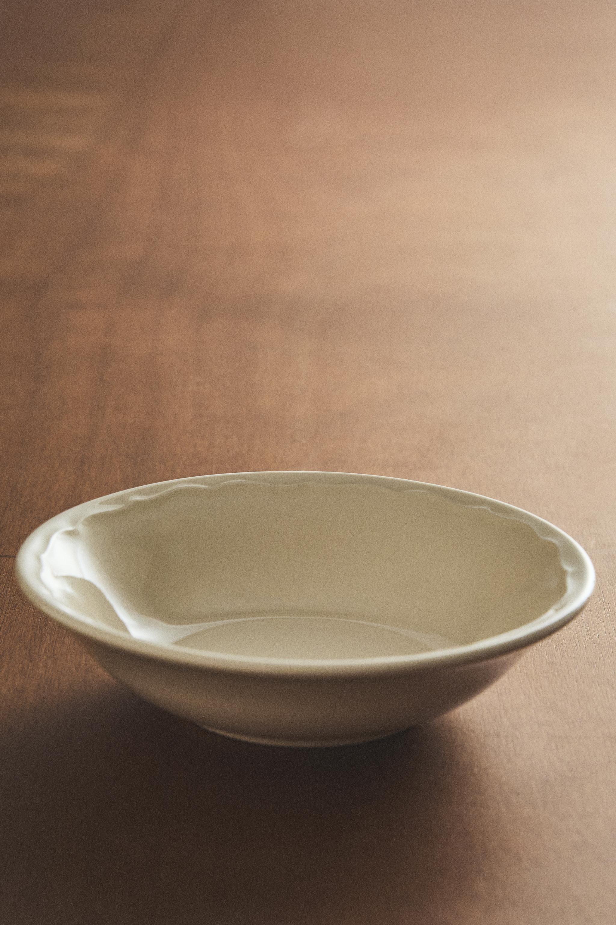 EARTHENWARE BOWL WITH RAISED-DESIGN EDGE