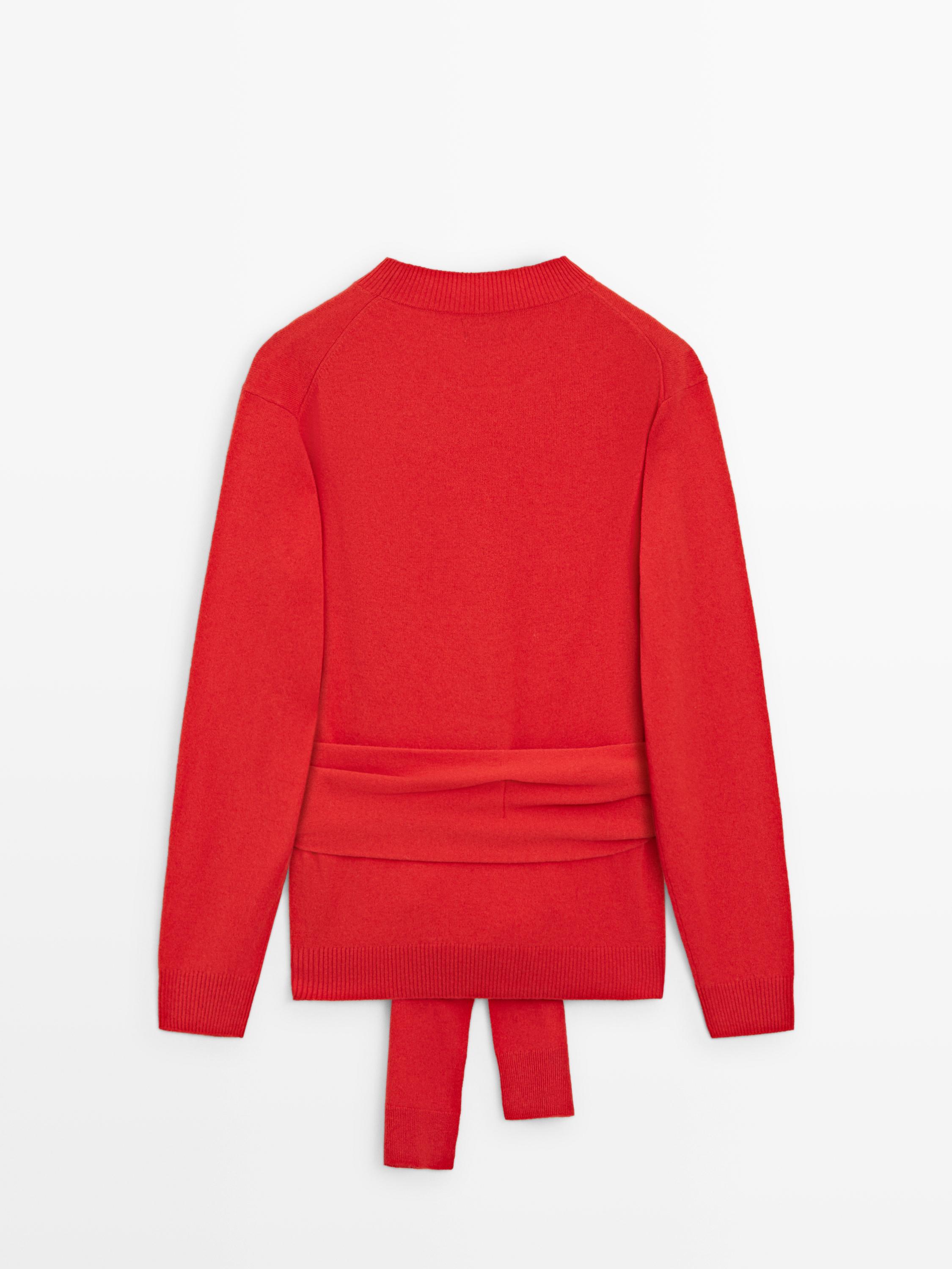 100% wool knit sweater with waist detail