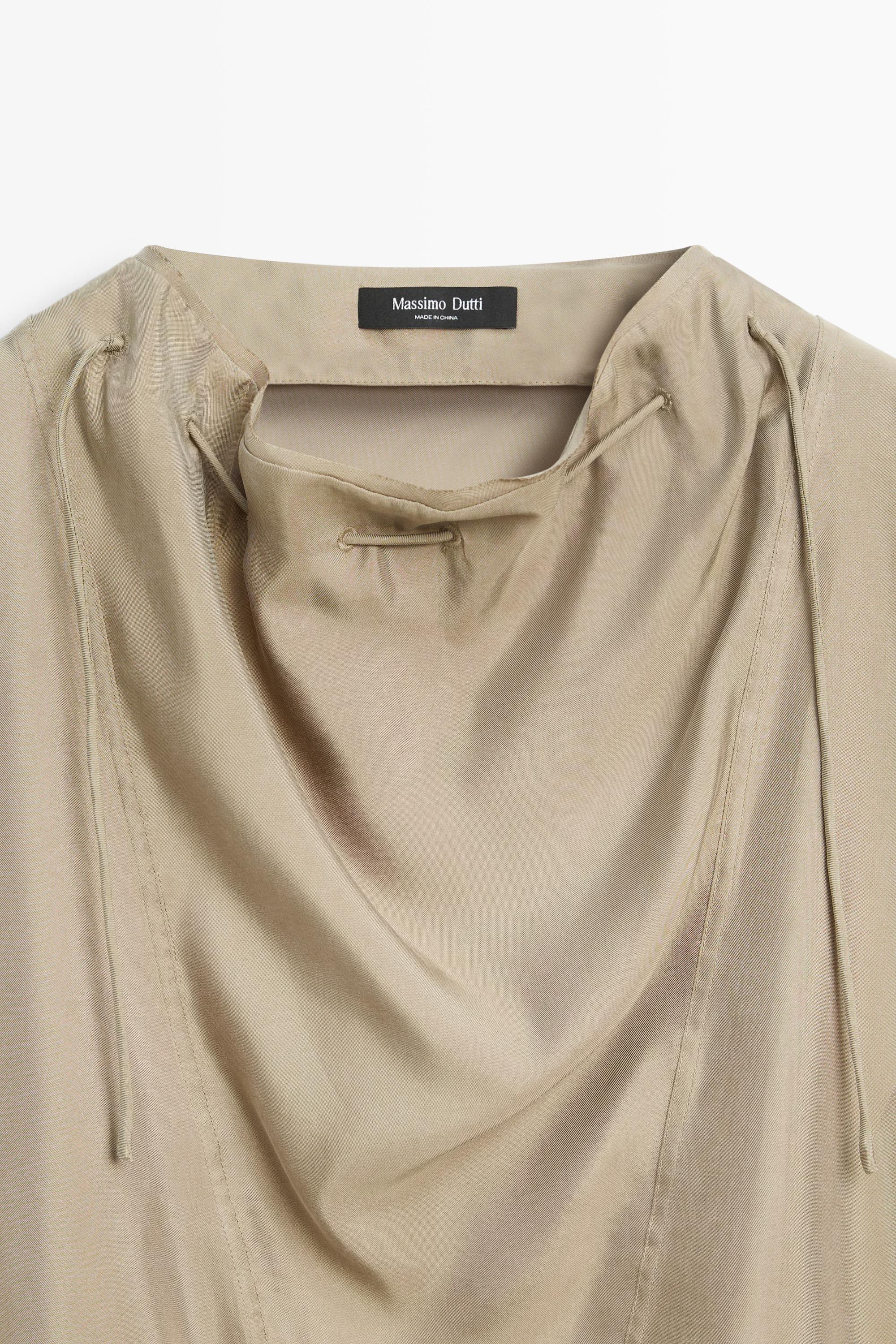 Blouse fluide à cordon au col
