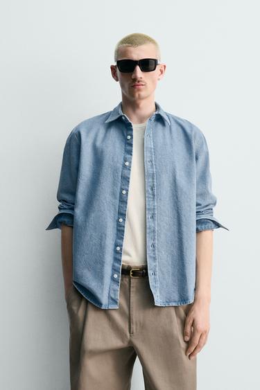 قميص دنيم بقصّة عادية ومظهر مغسول - أزرق باستيل الخاص بـ Zara